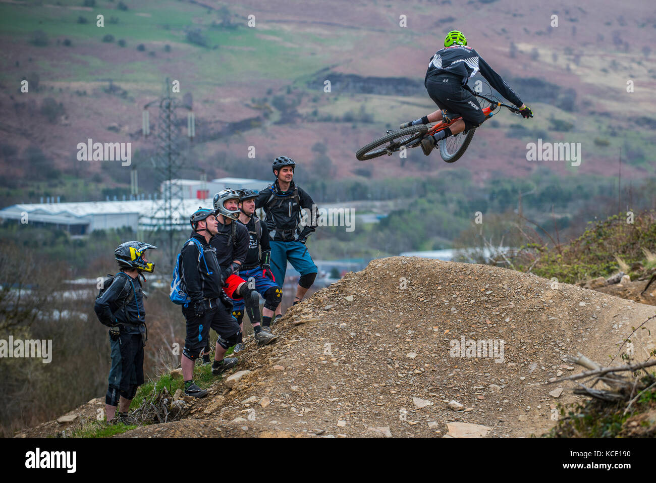 A mountain bike coach takes a group lesson at Bikepark Wales near