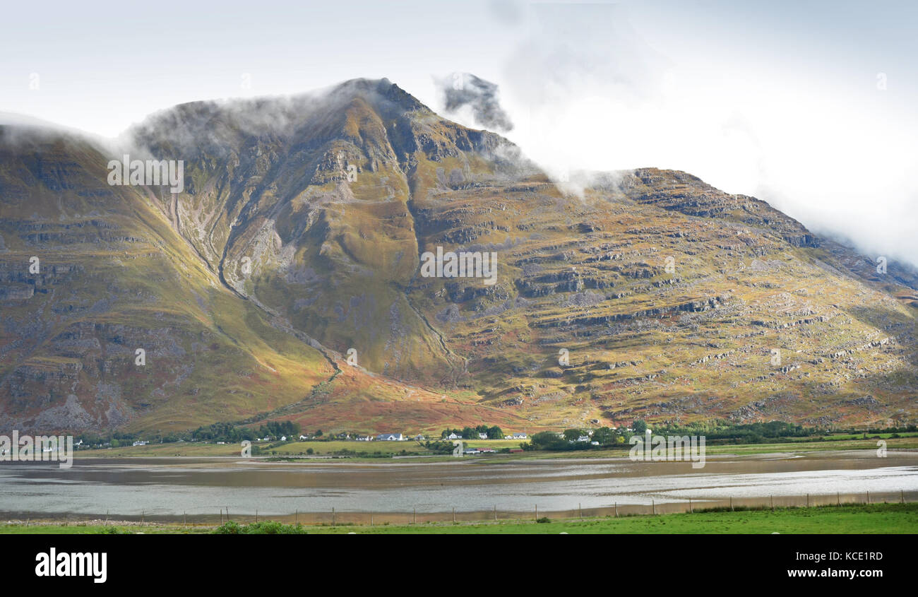 The village of Torridon in the western highlands of Scotland, UK. Viewed from the south across Loch Torridon. Shows peaks of Liathace & Beinn Eighe Stock Photo