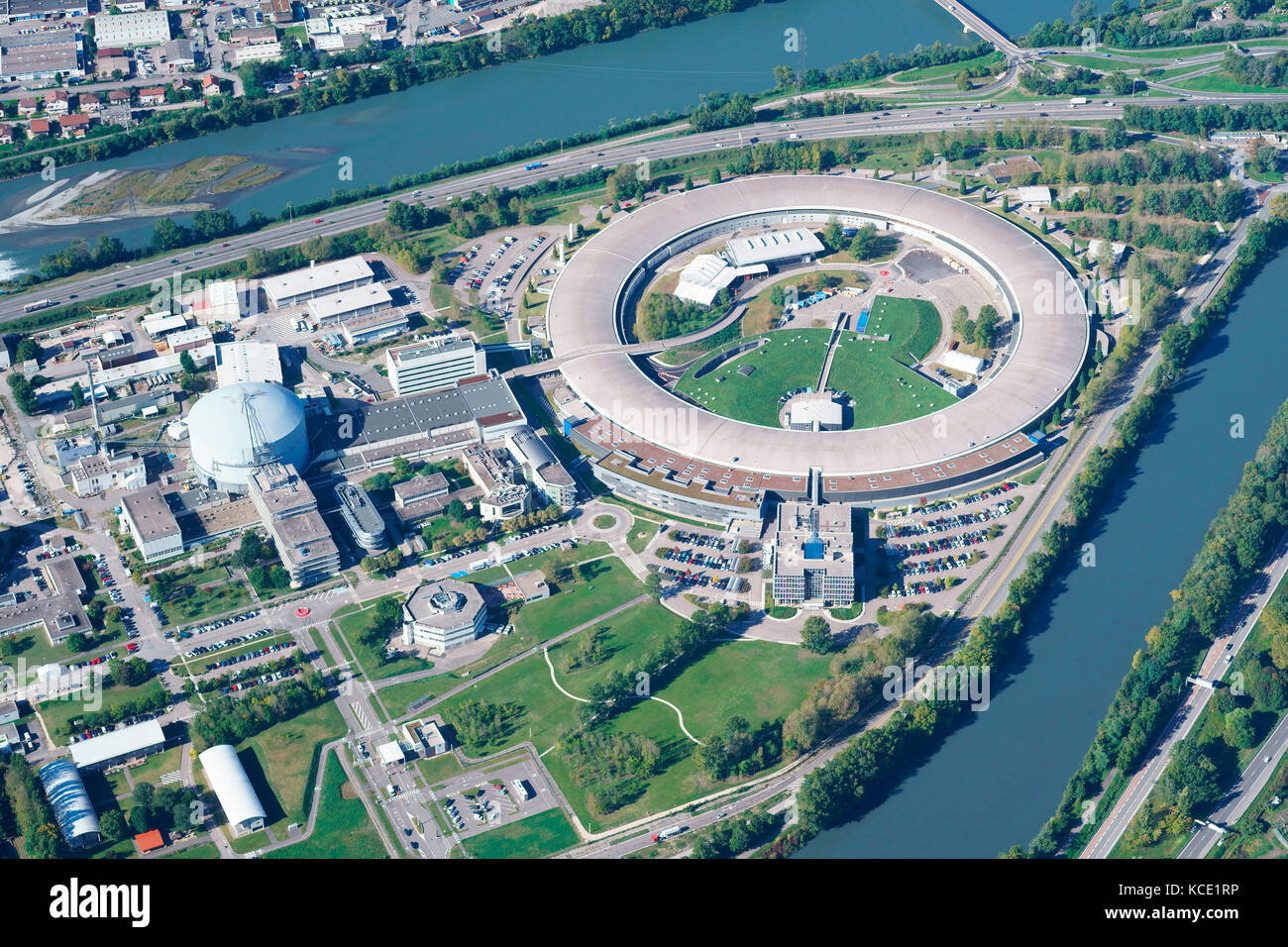 AERIAL VIEW. The European Synchrotron Radiation Facility, a research facility at the confluence of the Drac and the Isère River. Grenoble, France. Stock Photo