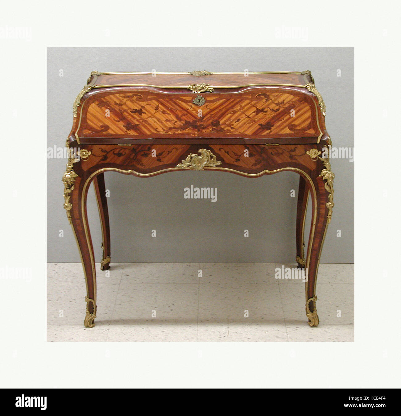 Slant-top desk (secrétaire en pente), ca. 1745–49, French, Oak veneered with bois satiné and end cut wood, leather, gilt bronze Stock Photo