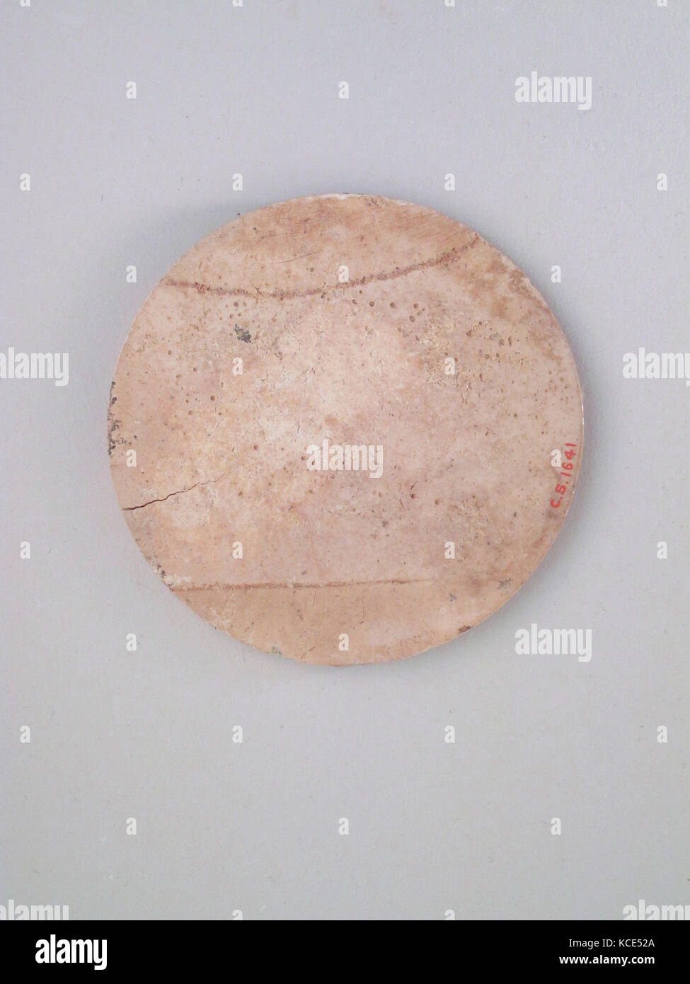 Roundel, disk, Bone, Diameter: 2 3/4 x 1/16 in. (7 x 0.2 cm Stock Photo