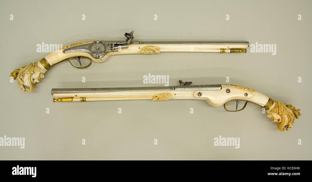 Pair of Wheellock Pistols, ca. 1655–65, Maastricht, Dutch, Maastricht, Steel, brass, gold, ivory, L. of 14.252a: 22 1/2 in Stock Photo