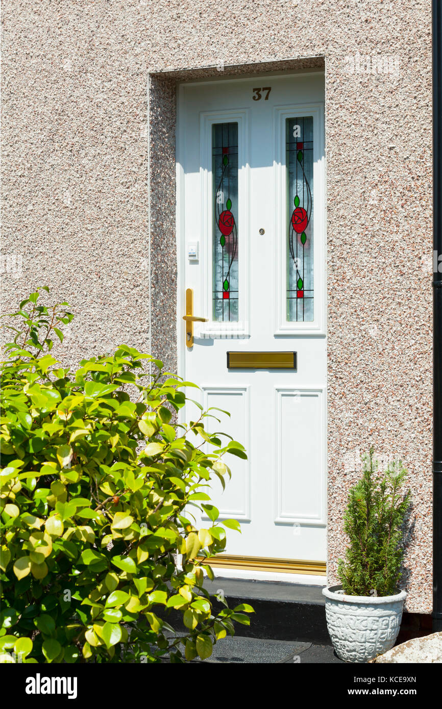 New traditional style front door with stained glass and brass door