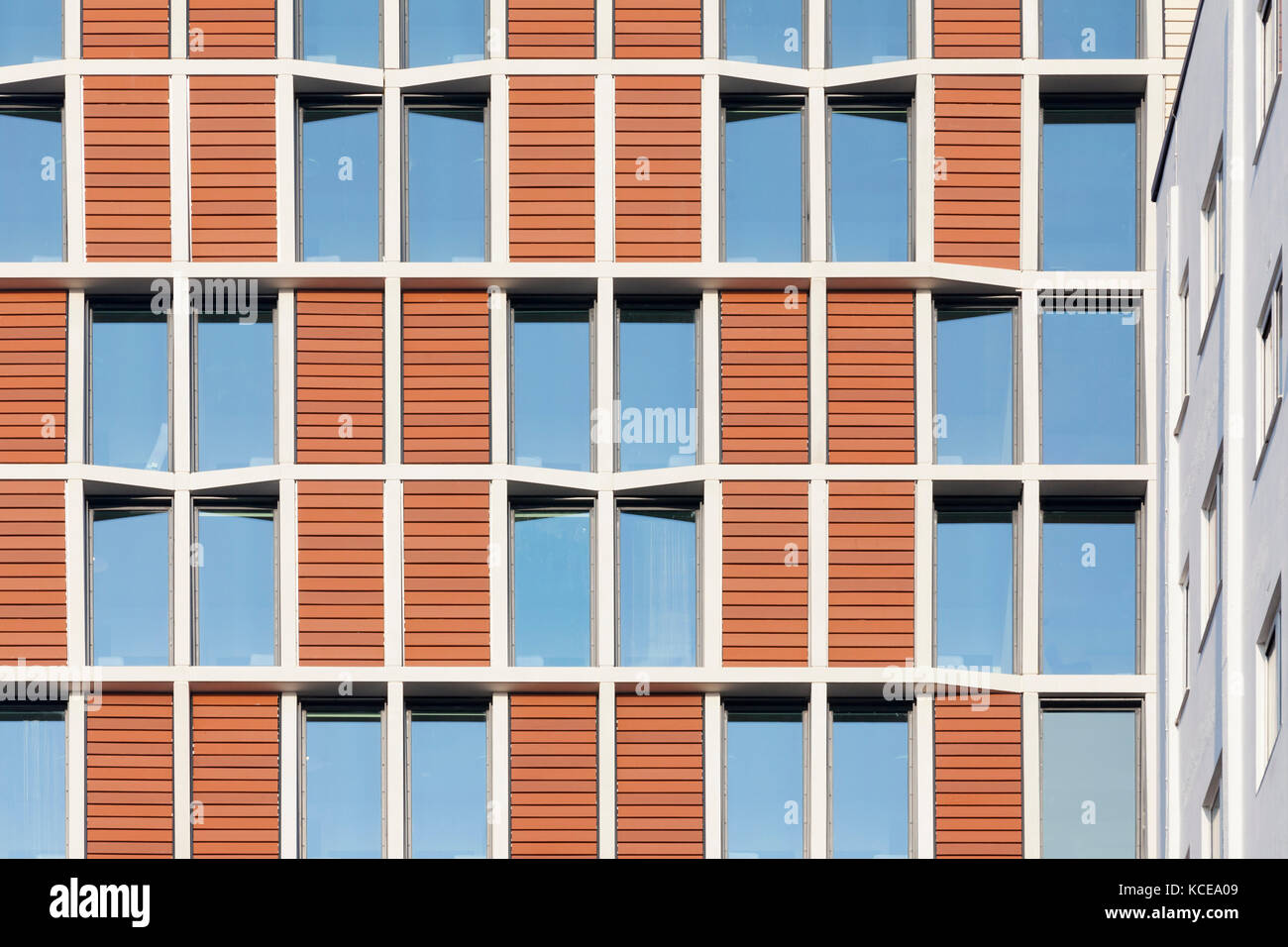 Patterns formed from the windows and cladding on the facade of student accommodation in London. The structure comprises a reinforced concrete frame wi Stock Photo