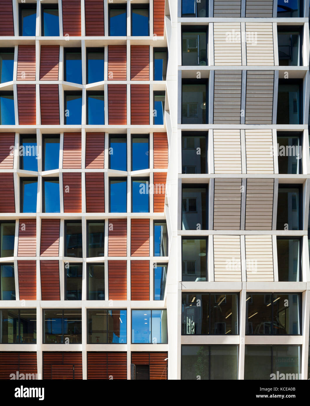 Patterns formed from the windows and cladding on the facade of student accommodation in London. The structure comprises a reinforced concrete frame wi Stock Photo