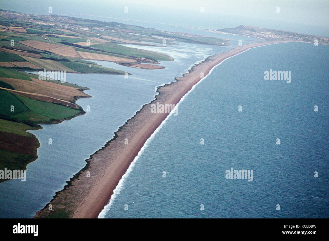 Aerial image of Chesil Beach Chesil Bank, 29 km long shingle beach, a  tombolo connecting mainland to the Isle of Portland, Jurassic Coast, UNESCO  Worl - SuperStock