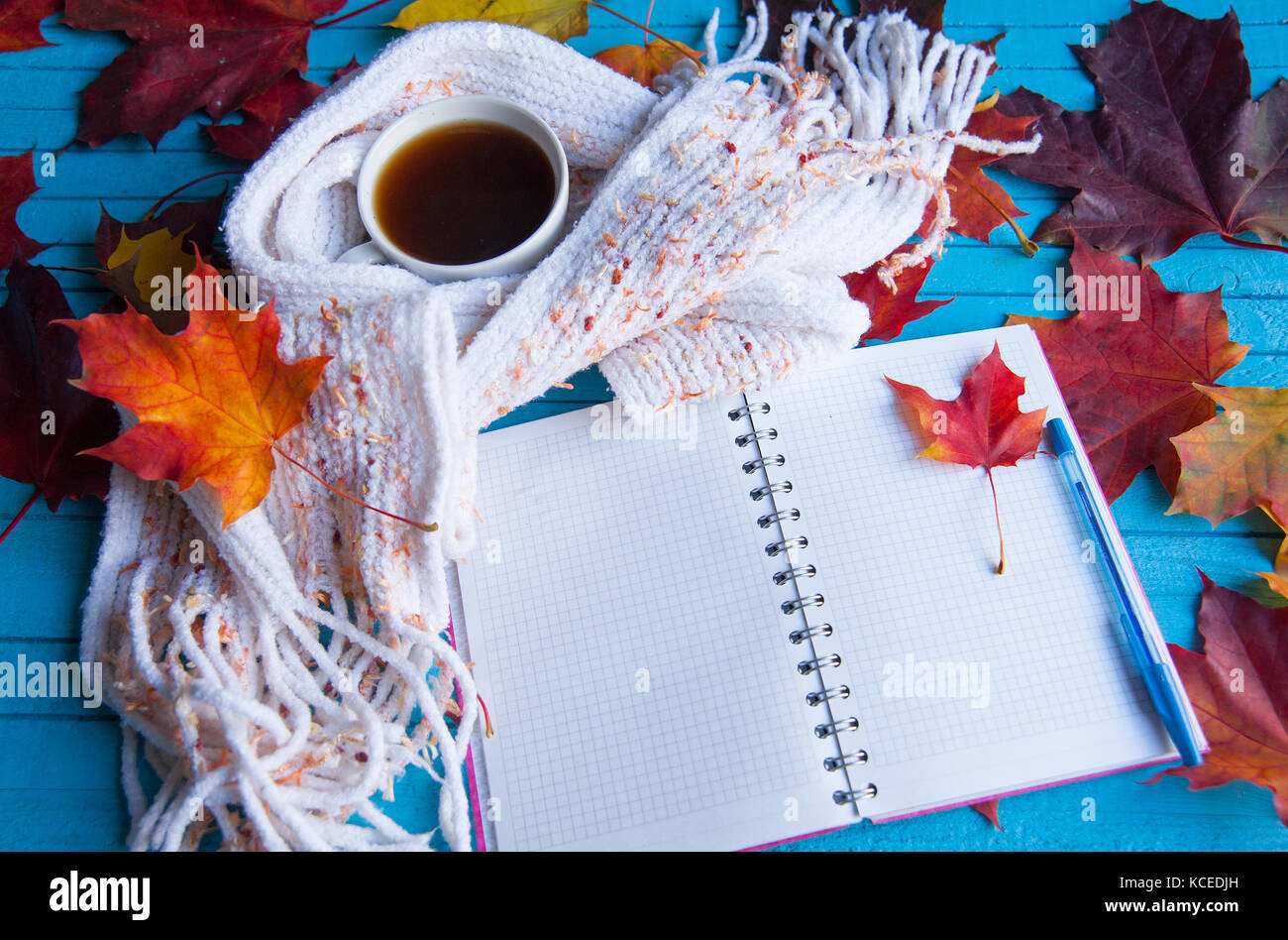 Cup of coffee surrounded by autumn leaves on the table Stock Photo - Alamy