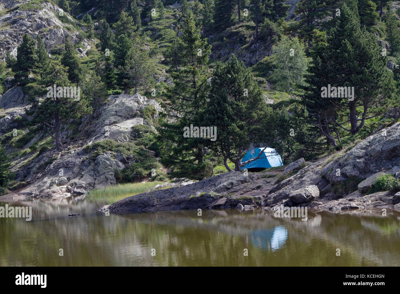 CHAMROUSSE, FRANCE, July 29, 2017 : Camping on the banks of the Lac Achard in the mountain resort of Chamrousse. Stock Photo