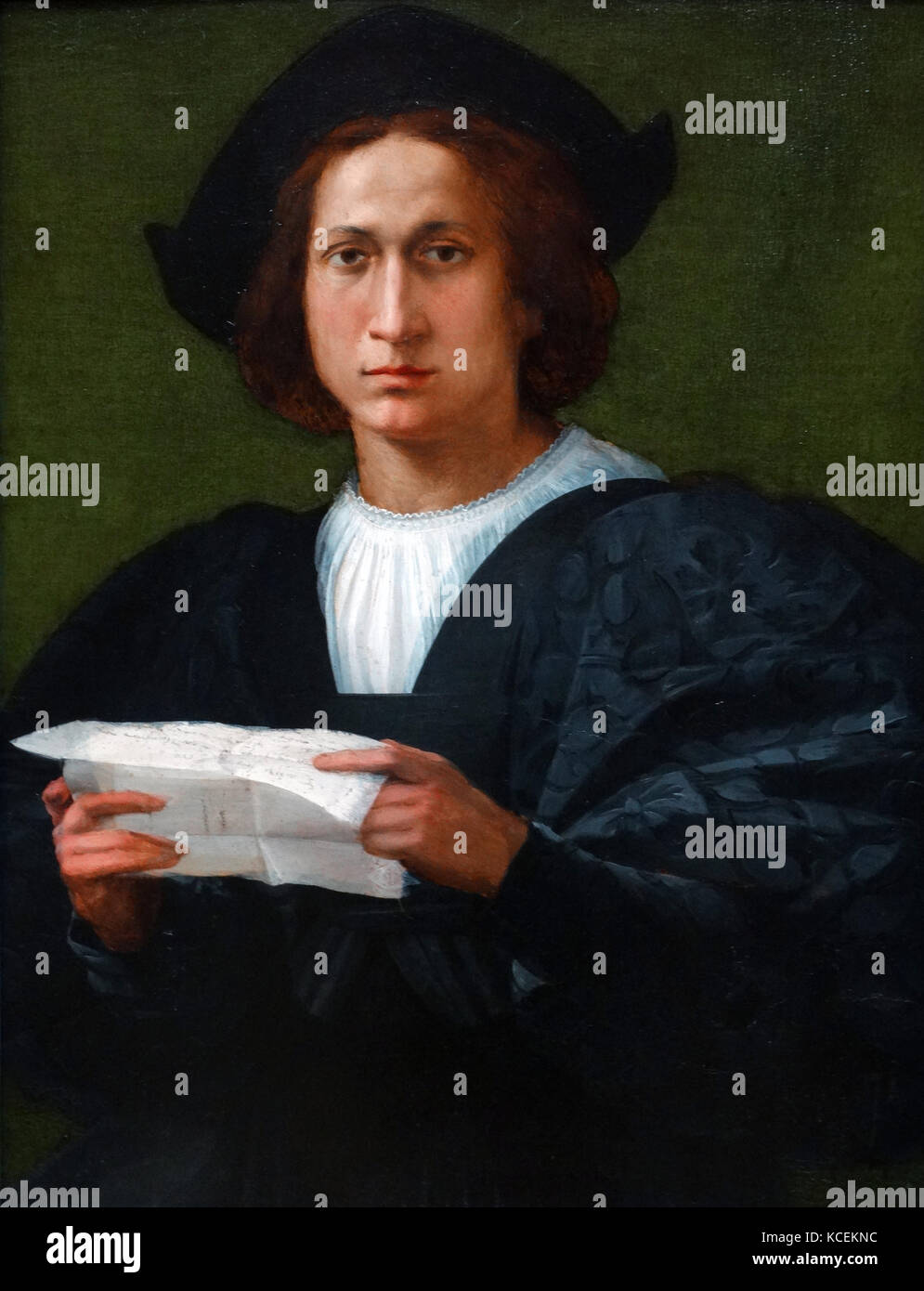 Painting titled 'Portrait of a Young Man holding a Letter' by Rosso Fiorentino (1495-1540) an Italian Mannerist painter. Dated 16th Century Stock Photo
