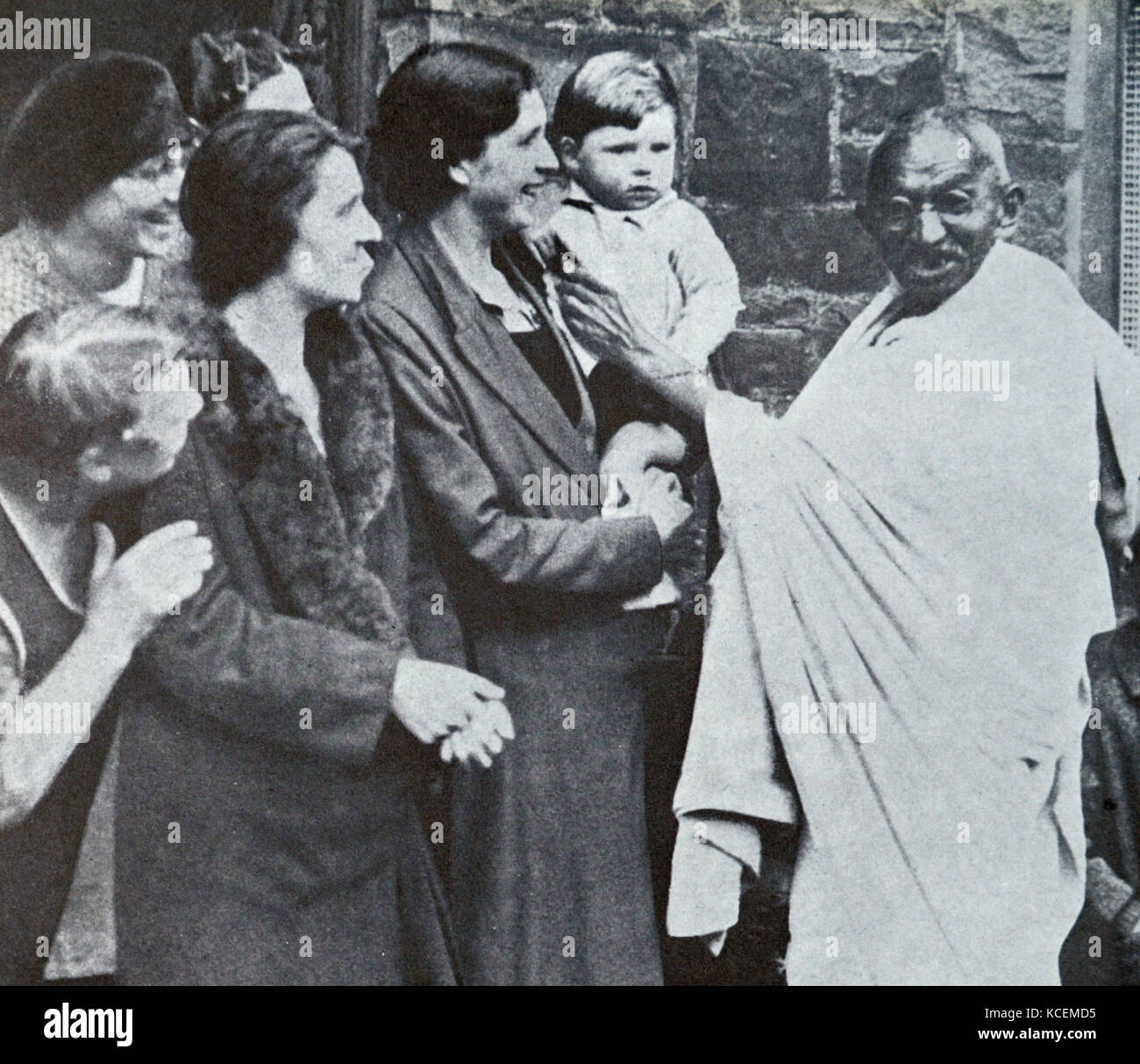 Mahatma Gandhi visits Lancashire's cotton mills in 1931, during his tour of England. Mohandas Gandhi (1869 – 1948) was the preeminent leader of the Indian independence movement in British-ruled India. Stock Photo