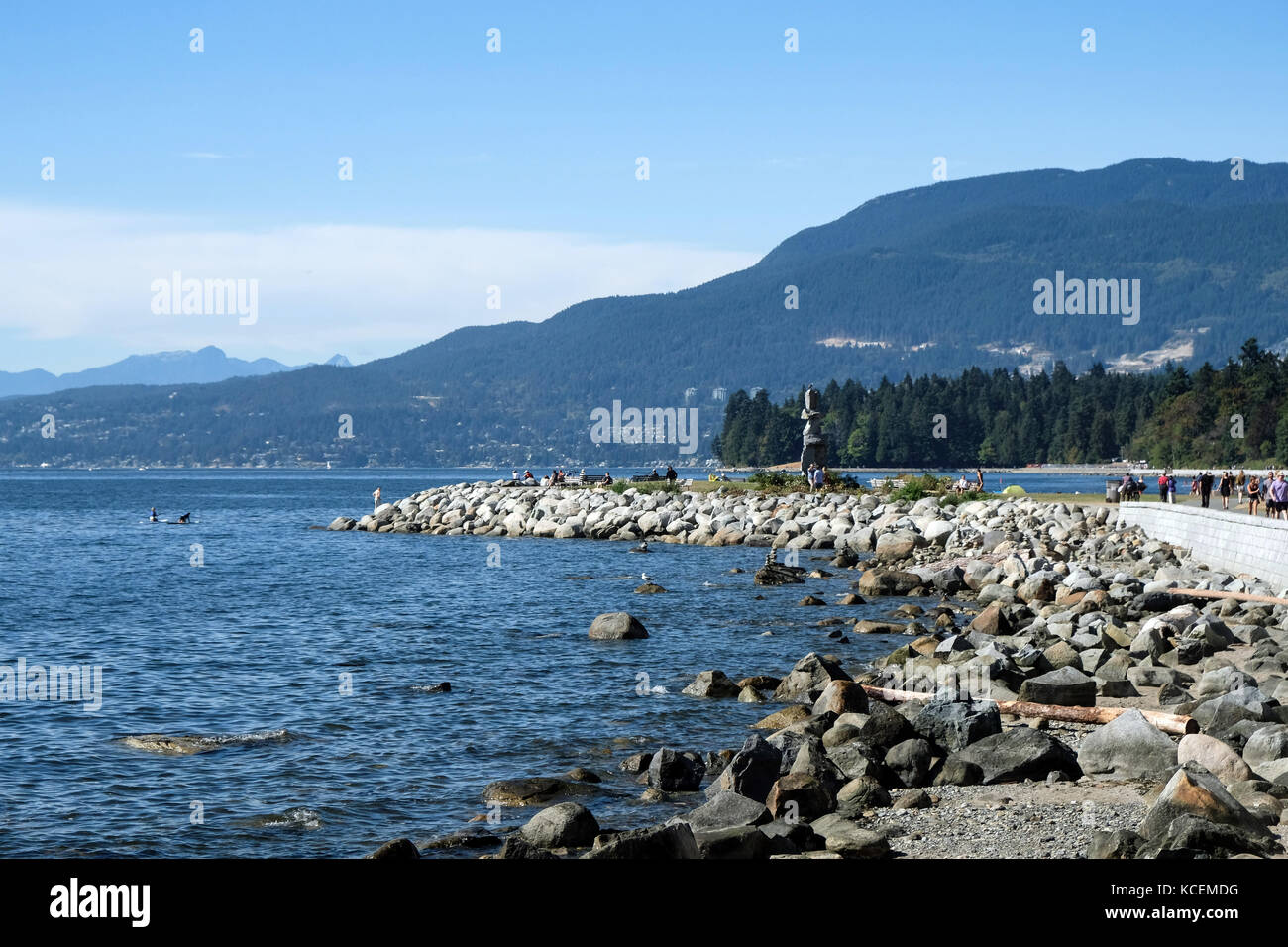Inukshuk, a human-made stone sculpture which is an ancient symbol of the Inuit culture. The sculpture sits along the  seawall trail in Vancouver, Brit Stock Photo