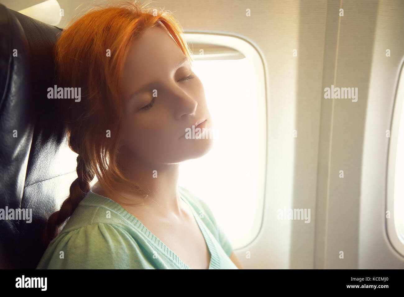 Woman sleeping plane hi-res stock photography and images - Alamy