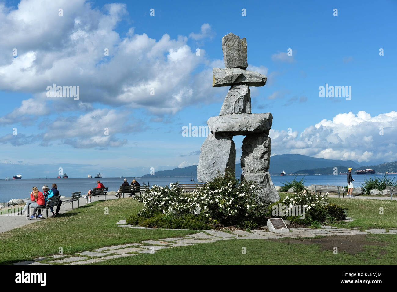 Inukshuk, a human-made stone sculpture which is an ancient symbol of the Inuit culture. The sculpture sits along the  seawall trail in Vancouver, Brit Stock Photo