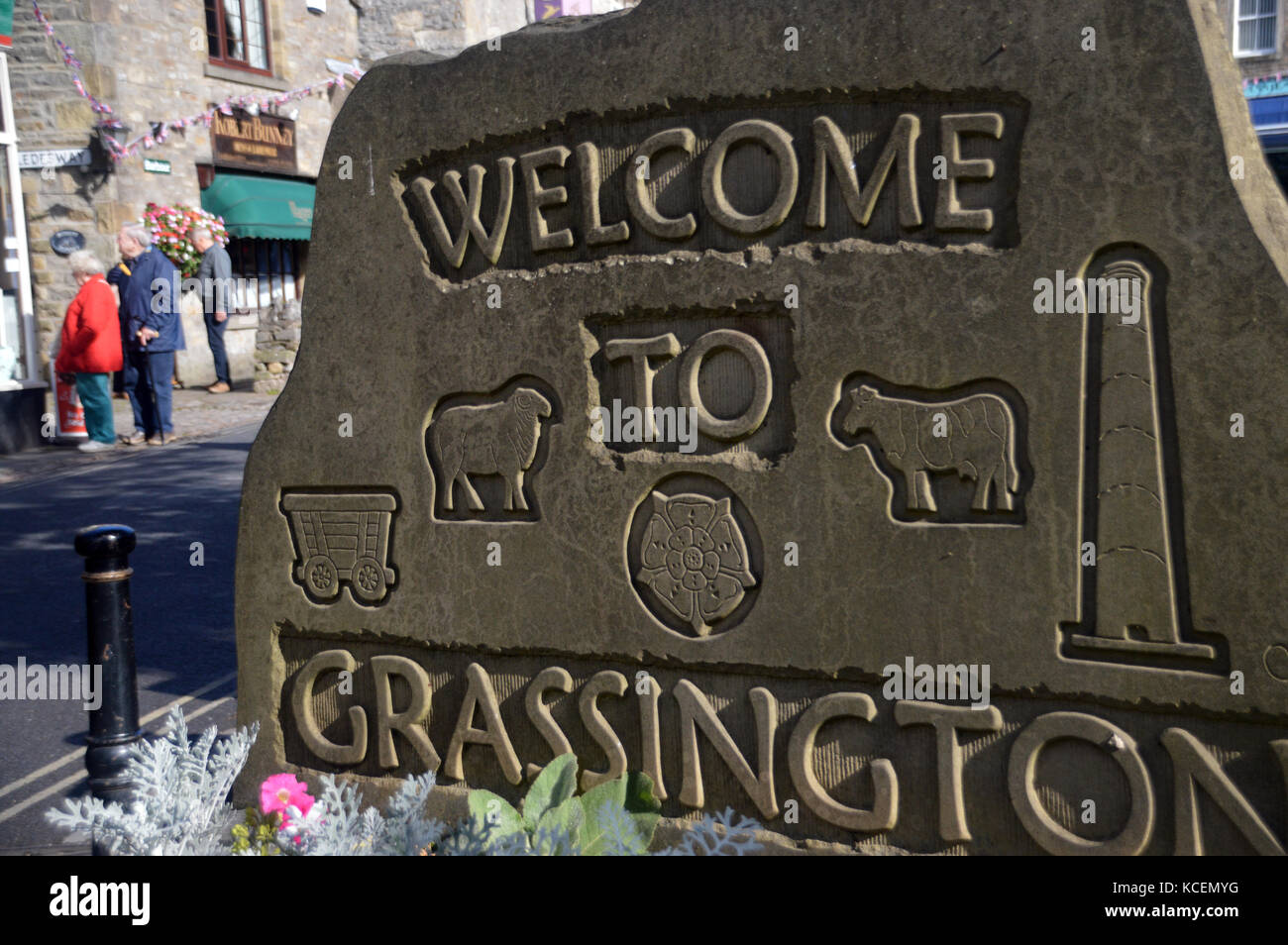 Stone Carved Welcome to Grassington Village Sign on the Dales Way Long Distance Footpath in Wharfedale, Yorkshire Dales National Park, England, UK. Stock Photo