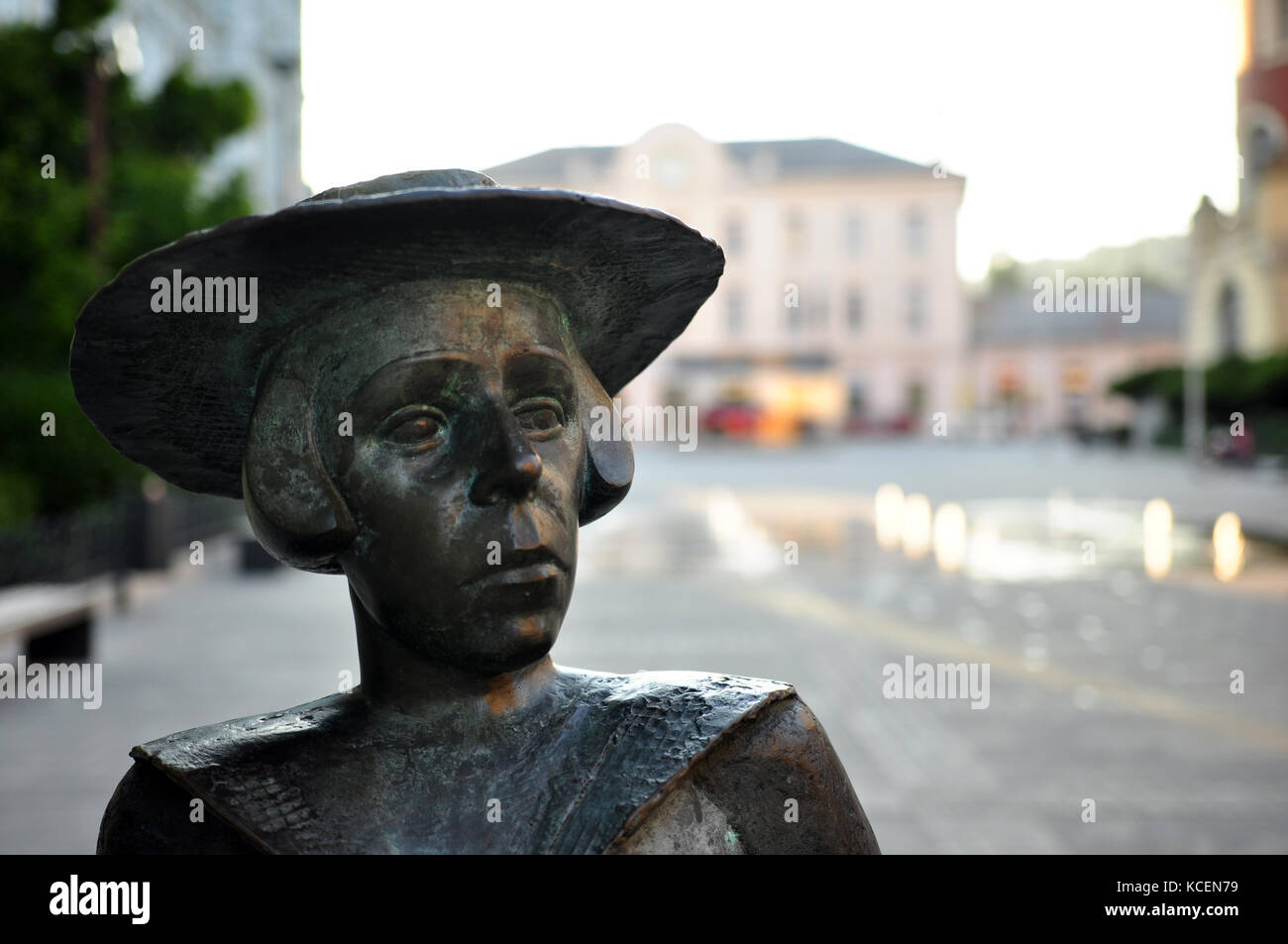 Human, woman statue with hat in the city square Stock Photo