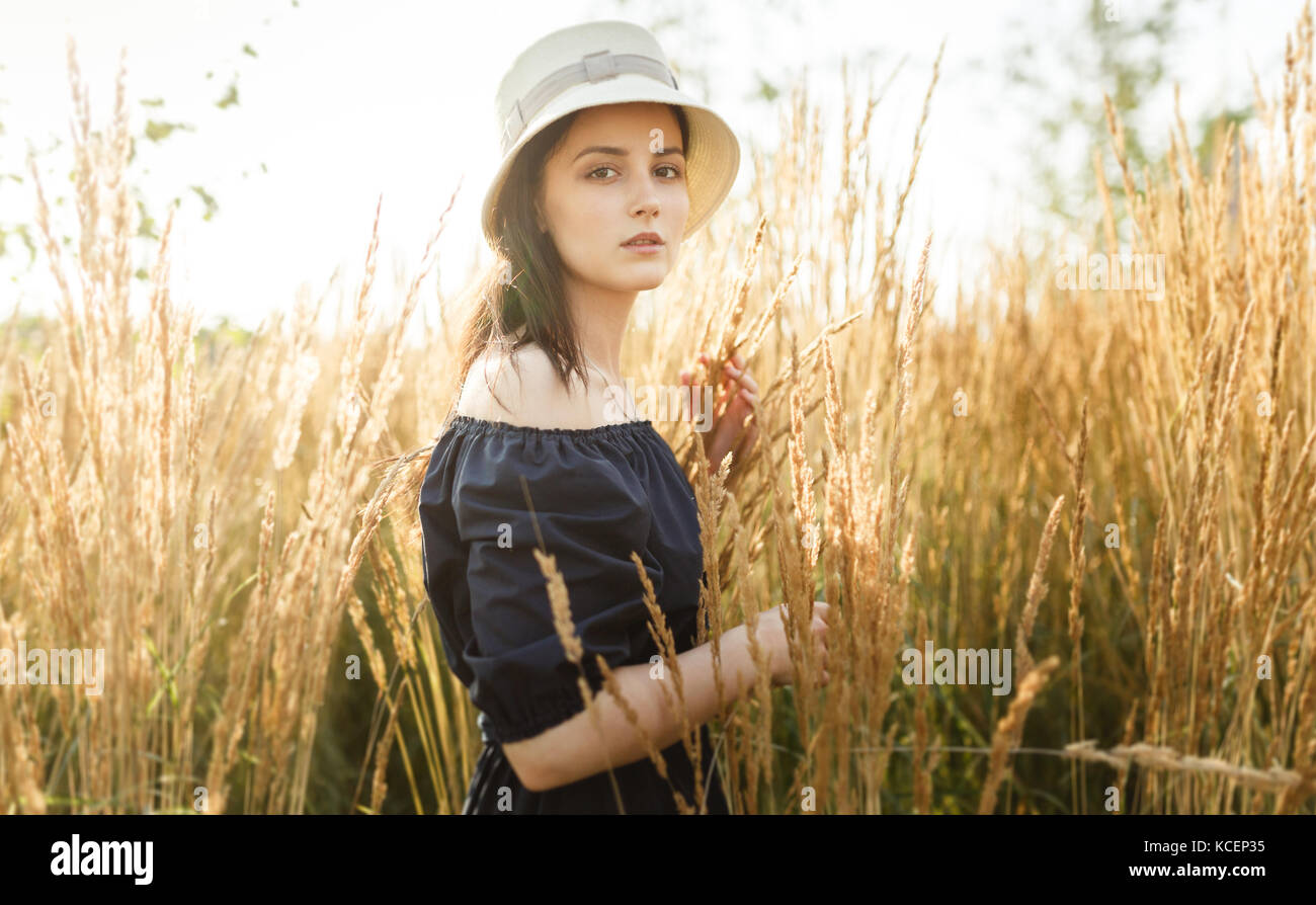 Photo of young woman at wheat field Stock Photo - Alamy