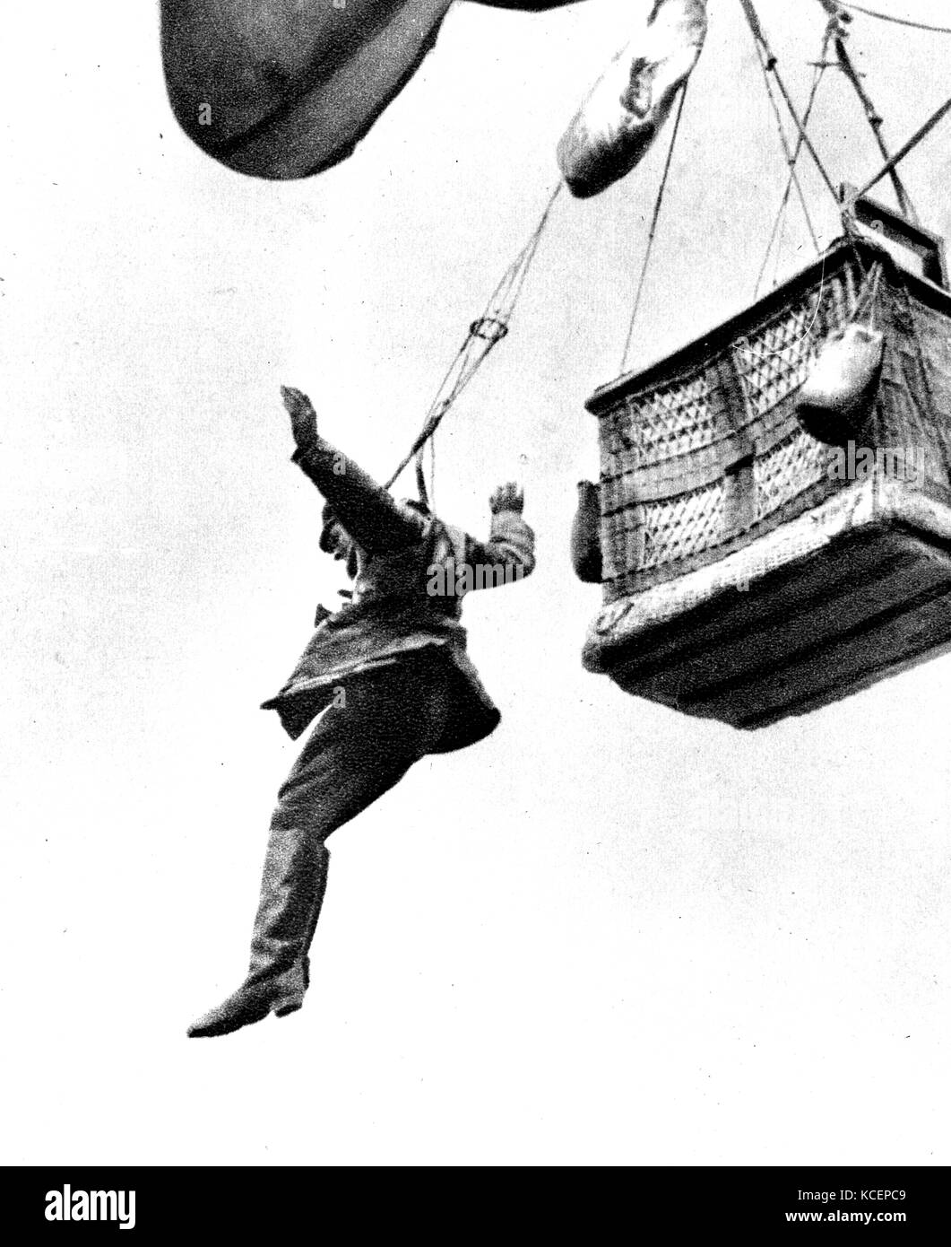 Photograph of a German soldier parachuting from an observation balloon which was damaged by enemy fire. Dated 20th Century Stock Photo