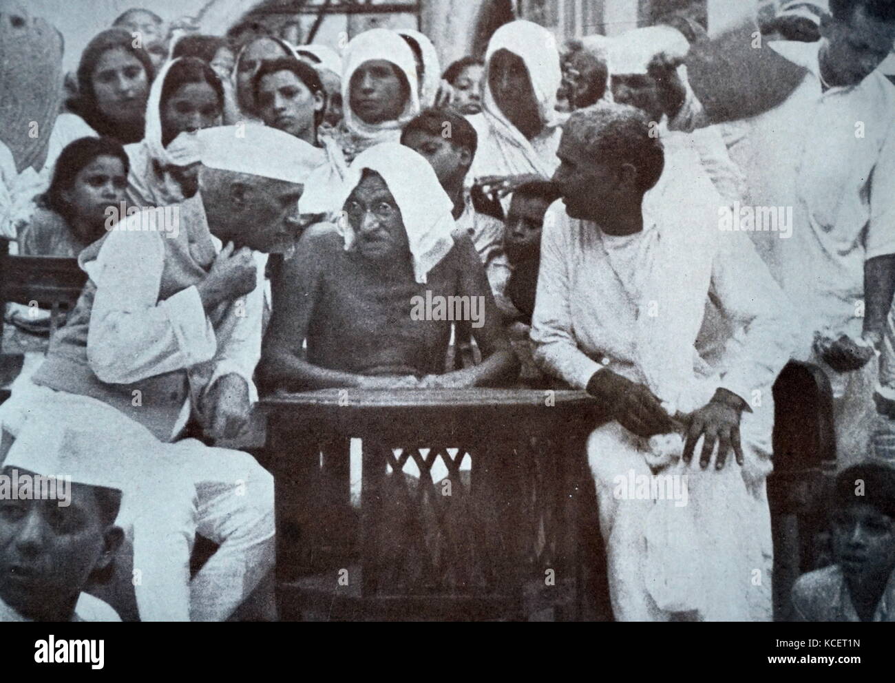 Gandhi and Jawaharlal Nehru addressing refugees from the Punjab at a camp in Hardwar, June 1947. Gandhi (2 October 1869 – 30 January 1948), was the preeminent leader of the Indian independence movement in British-ruled India. Stock Photo