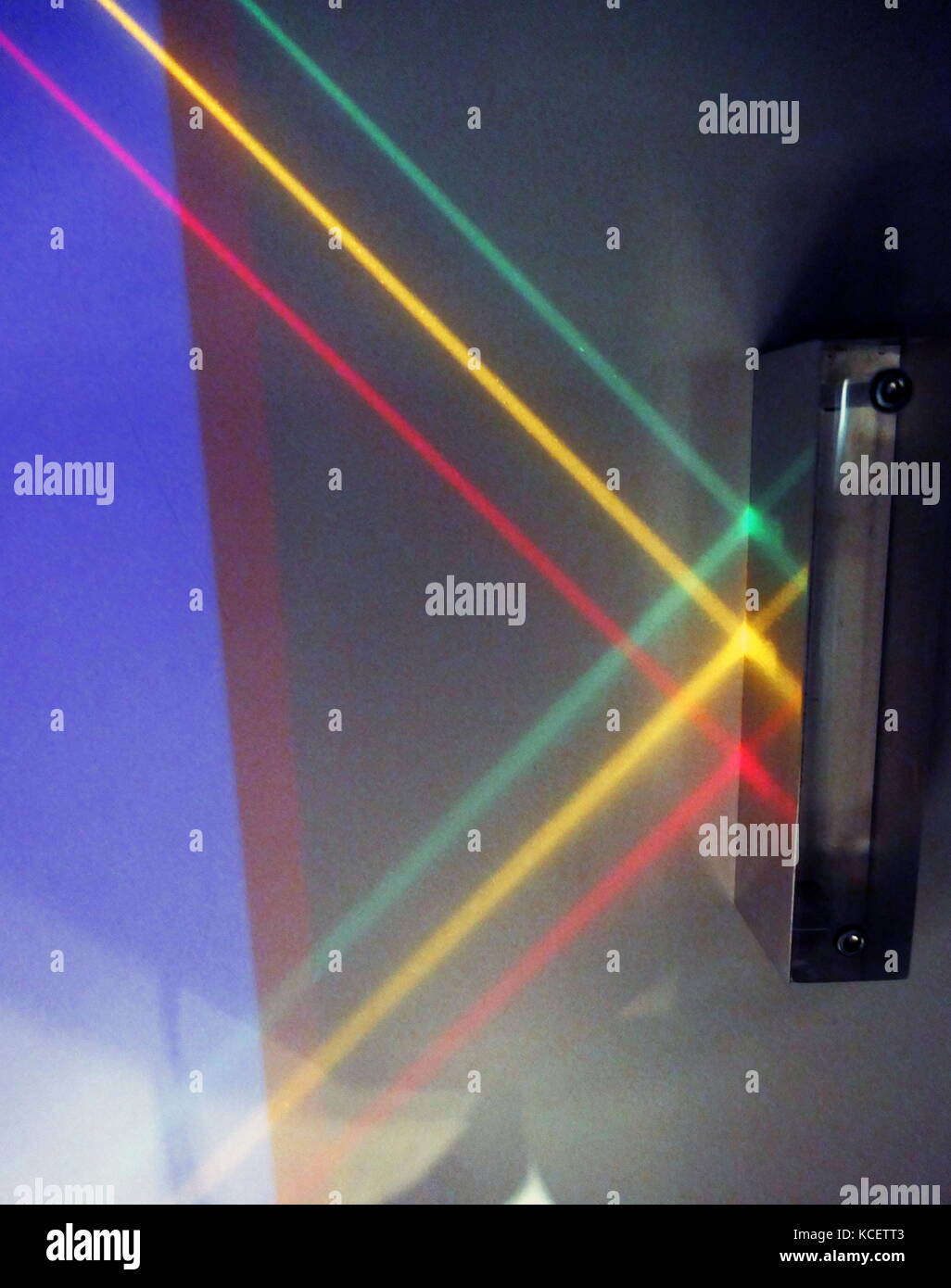Three parallel beams of light are reflected off a mirrored surface: Reflection is the change in direction of a wave front at an interface between two different media so that the wave front returns into the medium from which it originated. Common examples include the reflection of light, sound and water waves. The law of reflection says that for specular reflection the angle at which the wave is incident on the surface equals the angle at which it is reflected. Mirrors exhibit specular reflection. Stock Photo