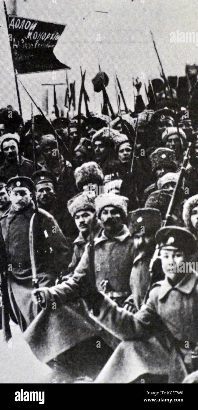 Russian soldiers (deserting), with a banner stating 'Down with the Monarchy' during the Russian Revolution of 1917 Stock Photo