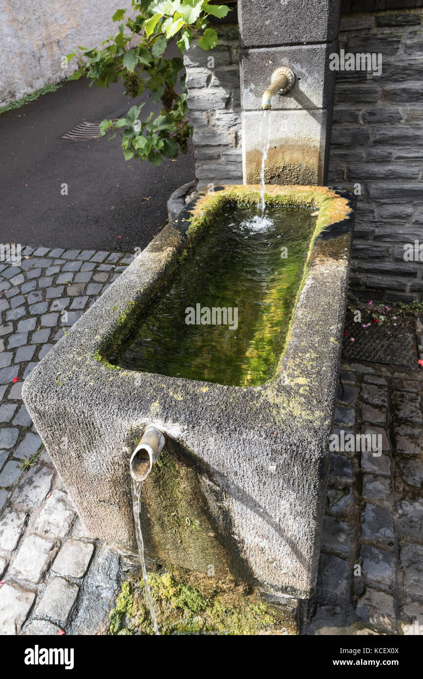 Water trough in the town of Urzig, in the Mosel Valley, Germany Stock Photo