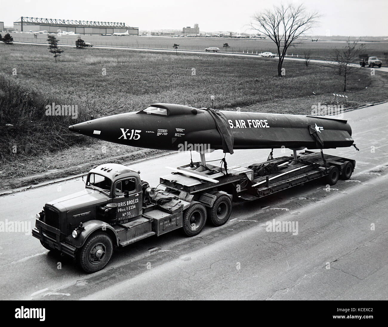 Photograph of the X-15 research aircraft being trucked to Cleveland Public Auditorium for complete assembly and display during the Space Science Fair of 1950. Dated 20th Century Stock Photo