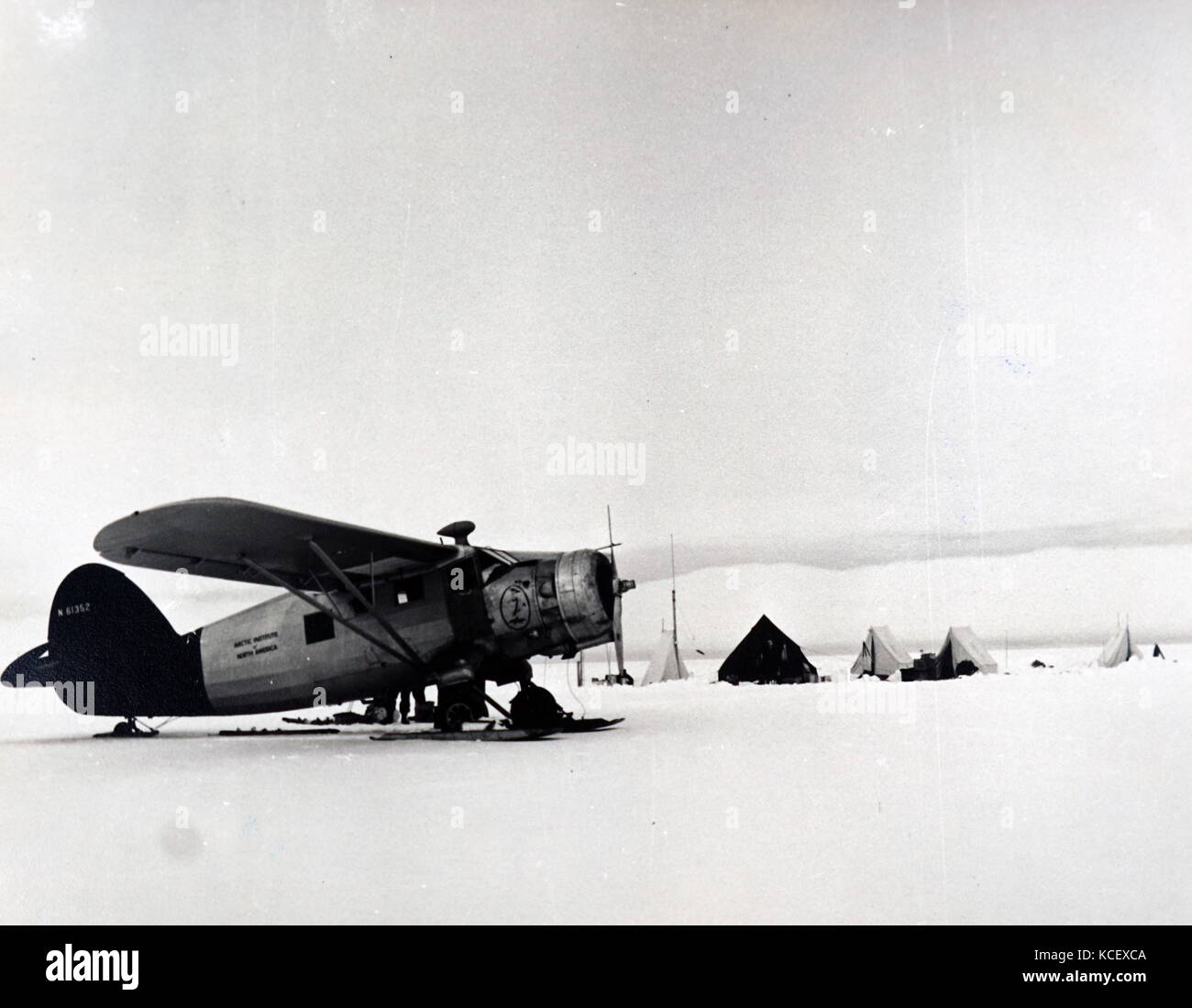 Photograph of a United States Arctic Expeditionary aircraft at research station within the Arctic Circle. Dated 20th Century Stock Photo