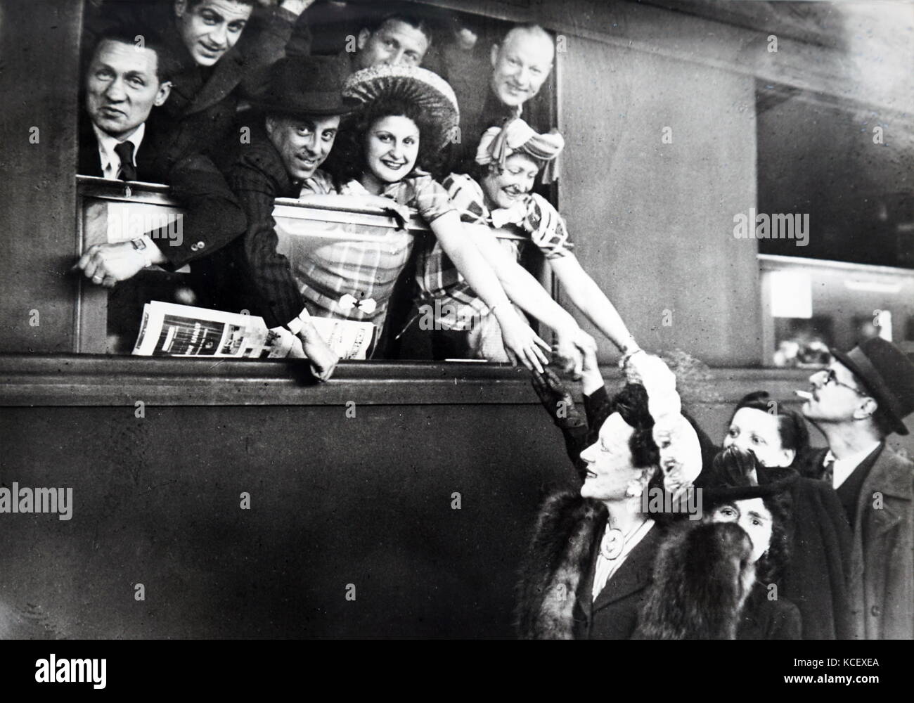 Photograph of French actors and singers leaving Paris to entertain French prisoners of War in Germany. Dated 20th Century Stock Photo