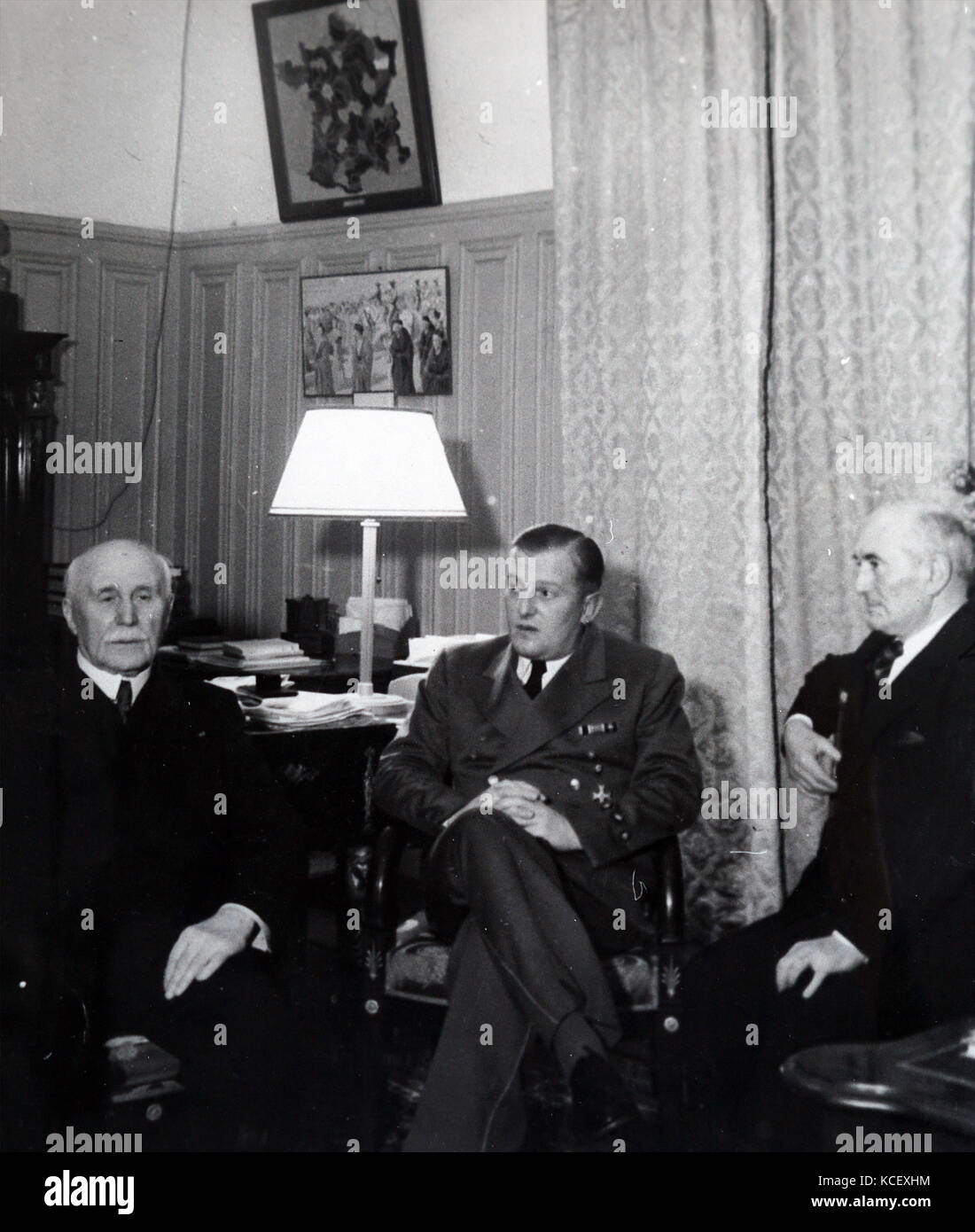 Photograph of leaders meeting in Vichy France: Marshal Philippe Petain (left), Admiral Francois Darlan (right), with the German ambassador, Otto Abetz. Dated 20th Century Stock Photo