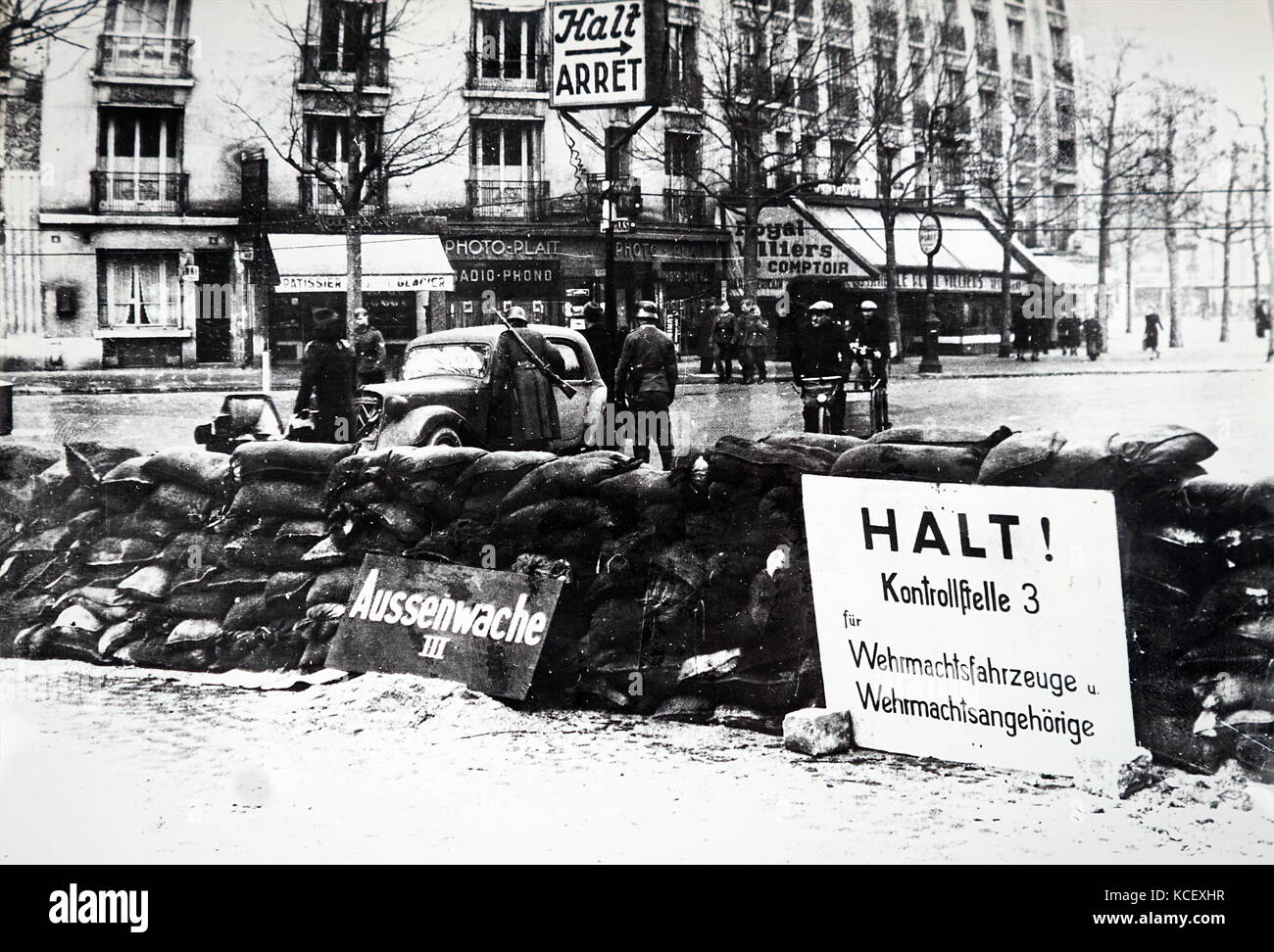 Photograph of German soldiers searching a vehicle at a road block in Paris, after the Invasion of France in 1940, in World War Two. Dated 20th Century Stock Photo