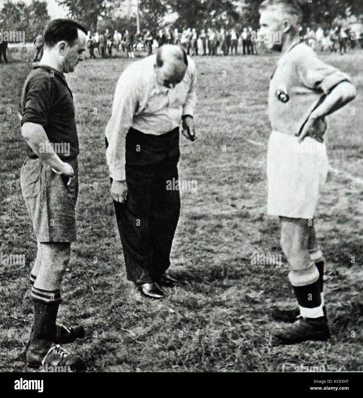 Propaganda photograph of German and French footballers about to start a friendly match, in Paris, after the Invasion of France in 1940, in World War Two. Dated 20th Century Stock Photo