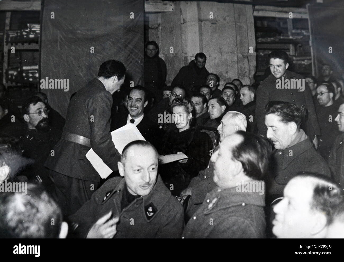 Photograph of a film screening in Paris, during the German occupation of France in World War Two. 1940. Danielle Darrieux and was present in the Army Cinema as the film 'Battements de Coeur ' (heartbeats), was shown. 1940 Danielle Yvonne Marie Antoinette Darrieux (born 1 May 1917) French actress and singer. Henri Decoin (1890 – 1969) was a French film director and screenwriter. Dated 20th Century Stock Photo