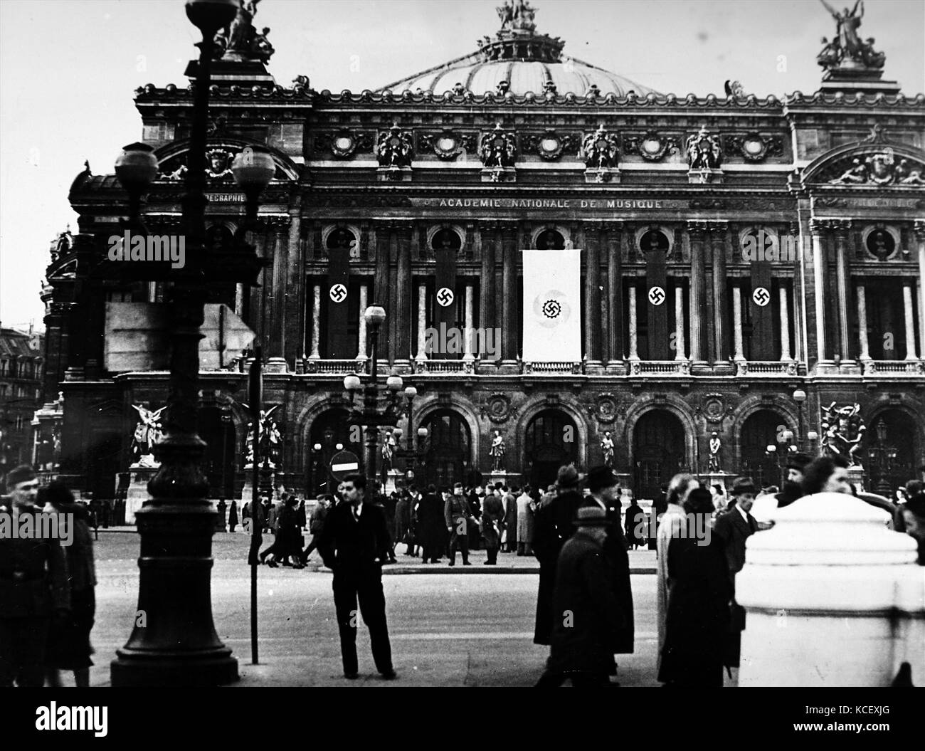 Photograph of Nazi flags hanging from the Paris Opera House, during the German occupation of France, in World War Two. Dated 20th Century Stock Photo