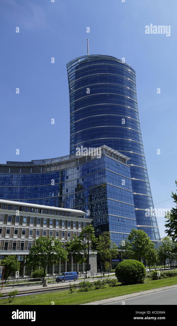 Photograph of the Warsaw Spire is a complex of Neomodern office buildings in Warsaw, Poland constructed by the Belgian real estate developer Ghelamco. It consists of a 220-metre main tower with a hyperboloid glass facade, Warsaw Spire A. Dated 21st Century Stock Photo