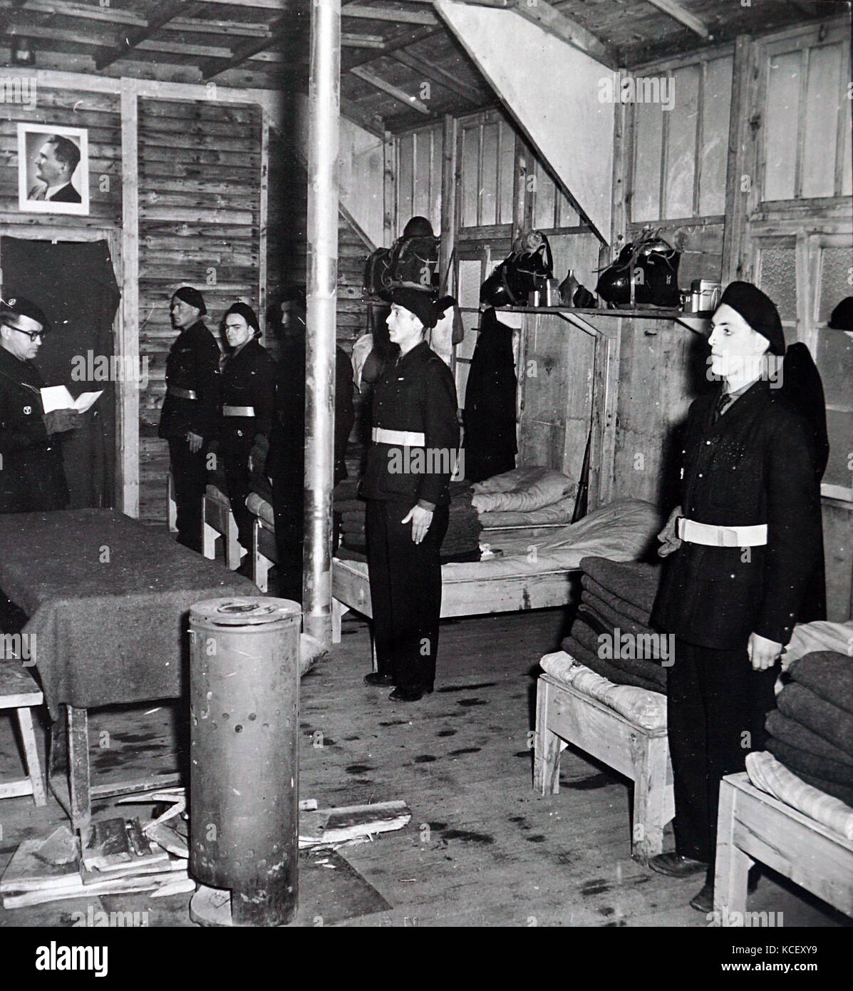 Photograph of French soldiers praying in their barracks in occupied France during World War Two. Dated 20th Century Stock Photo