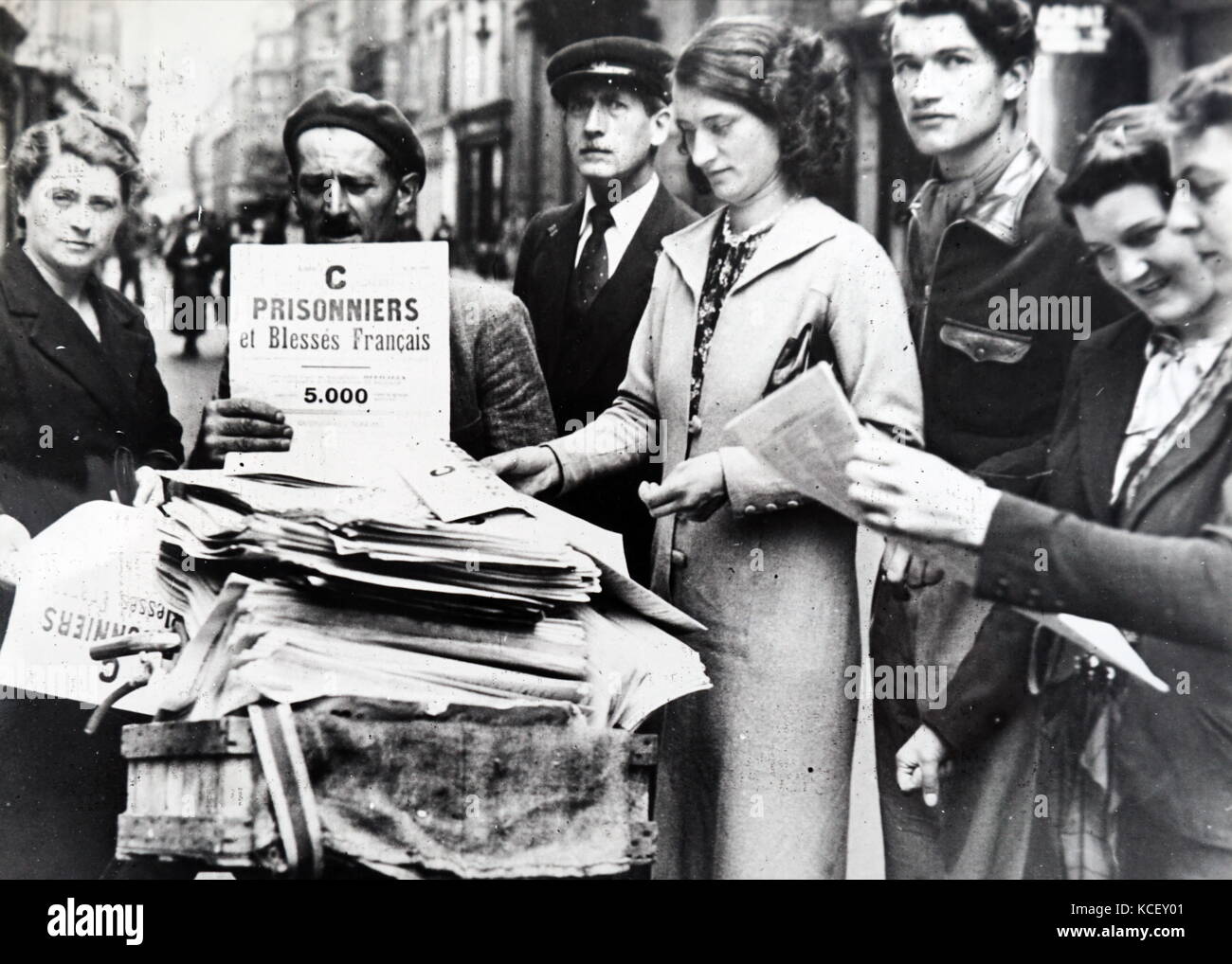 Photograph of the lists of prisoners of war being distributed in Paris , after the invasion of France in World War Two. Dated 20th Century Stock Photo