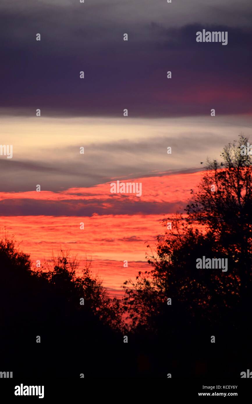 real sunrise in the Country in autumn after a stormy night, daybreak in Bavaria, sun up in fall Stock Photo