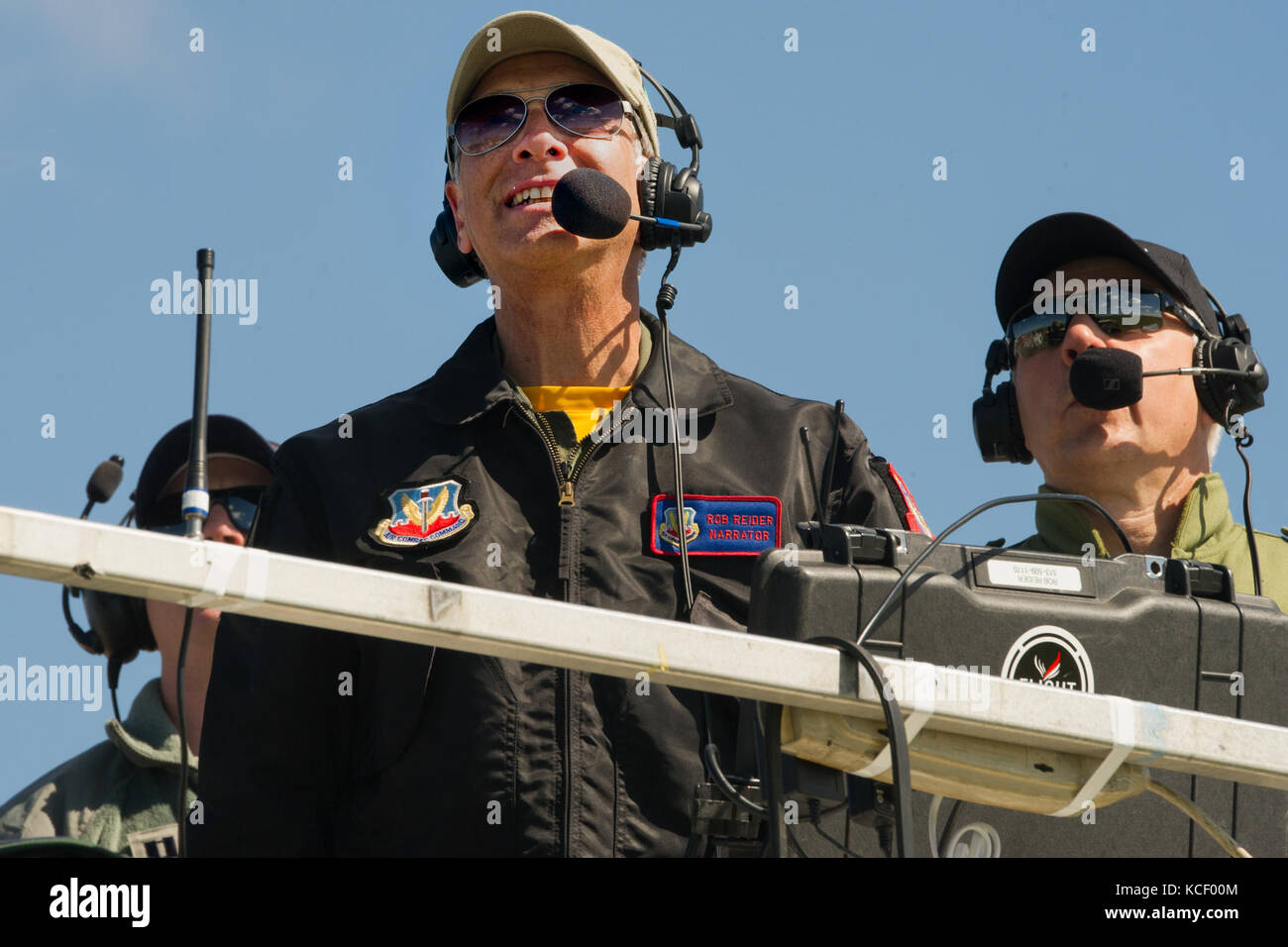 Narrator Rob Reider details each aircraft as they fly over the South Carolina Guard Air &amp; Ground Expo at McEntire Joint National Guard Base, South Carolina, May 6, 2017. This expo is to showcase the abilities of South Carolina National Guard Airmen and Soldiers while saying thank you for the support of fellow South Carolinians and the surrounding community. (U.S. Army National Guard photo by Sgt. Brian Calhoun) Stock Photo