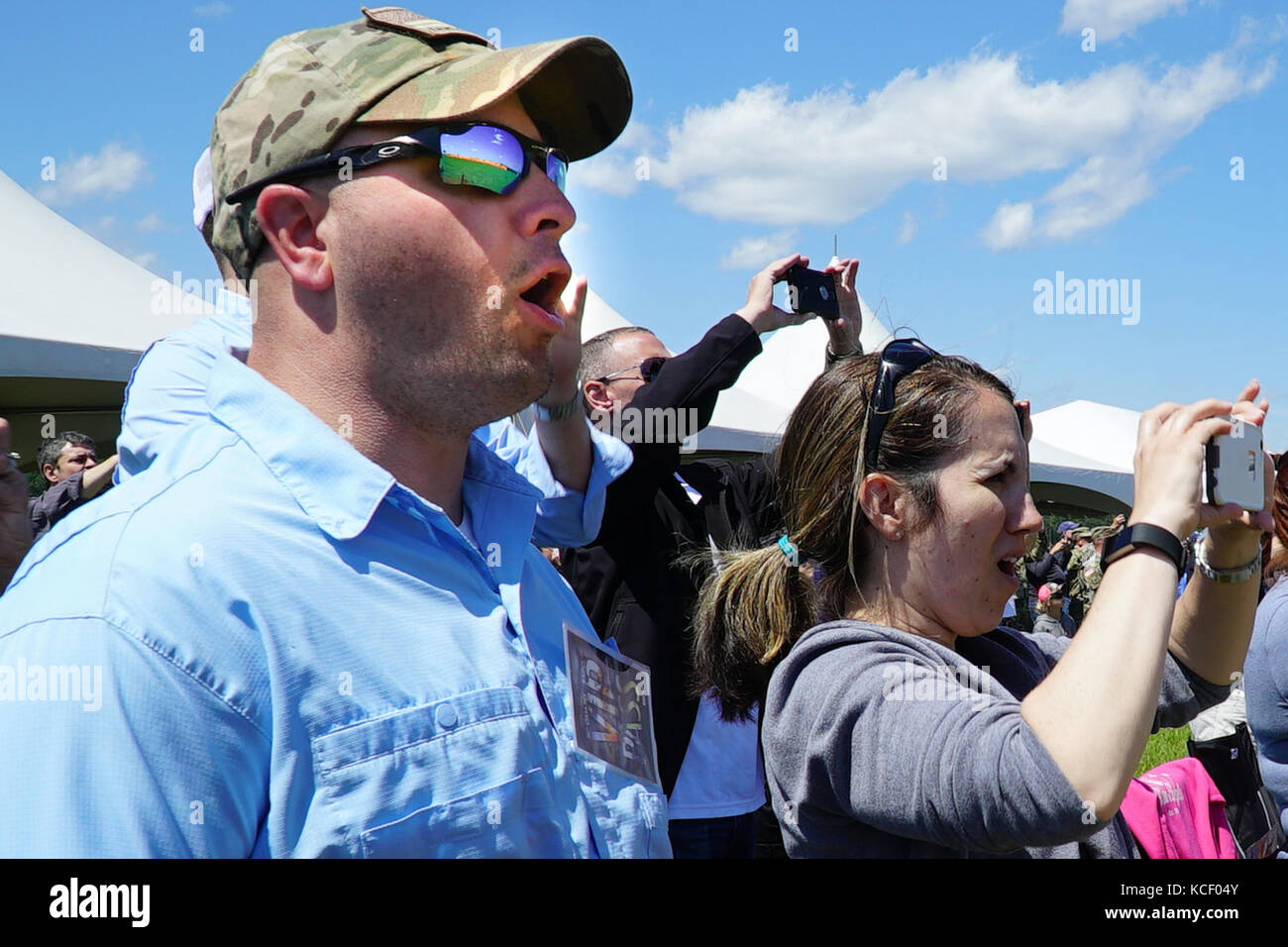 The crowd reacts during the South Carolina National Guard Air and Ground Expo at McEntire Joint National Guard Base, South Carolina, May 6, 2017. This expo is a combined arms demonstration showcasing the abilities of South Carolina National Guard Airmen and Soldiers while saying thank you for the support of fellow South Carolinians and the surrounding community. (U.S. Army National Guard photo by Capt. Brian Hare) Stock Photo