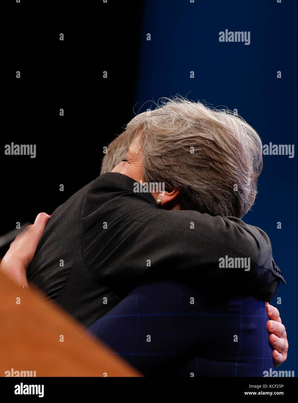 Manchester. 4th Oct, 2017. Britain's Prime Minister Theresa May is embraced by husband Philip after delivering her keynote speech on the last day of the Conservative Party Annual Conference in Manchester, Britain on Oct. 4, 2017. Credit: Han Yan/Xinhua/Alamy Live News Stock Photo