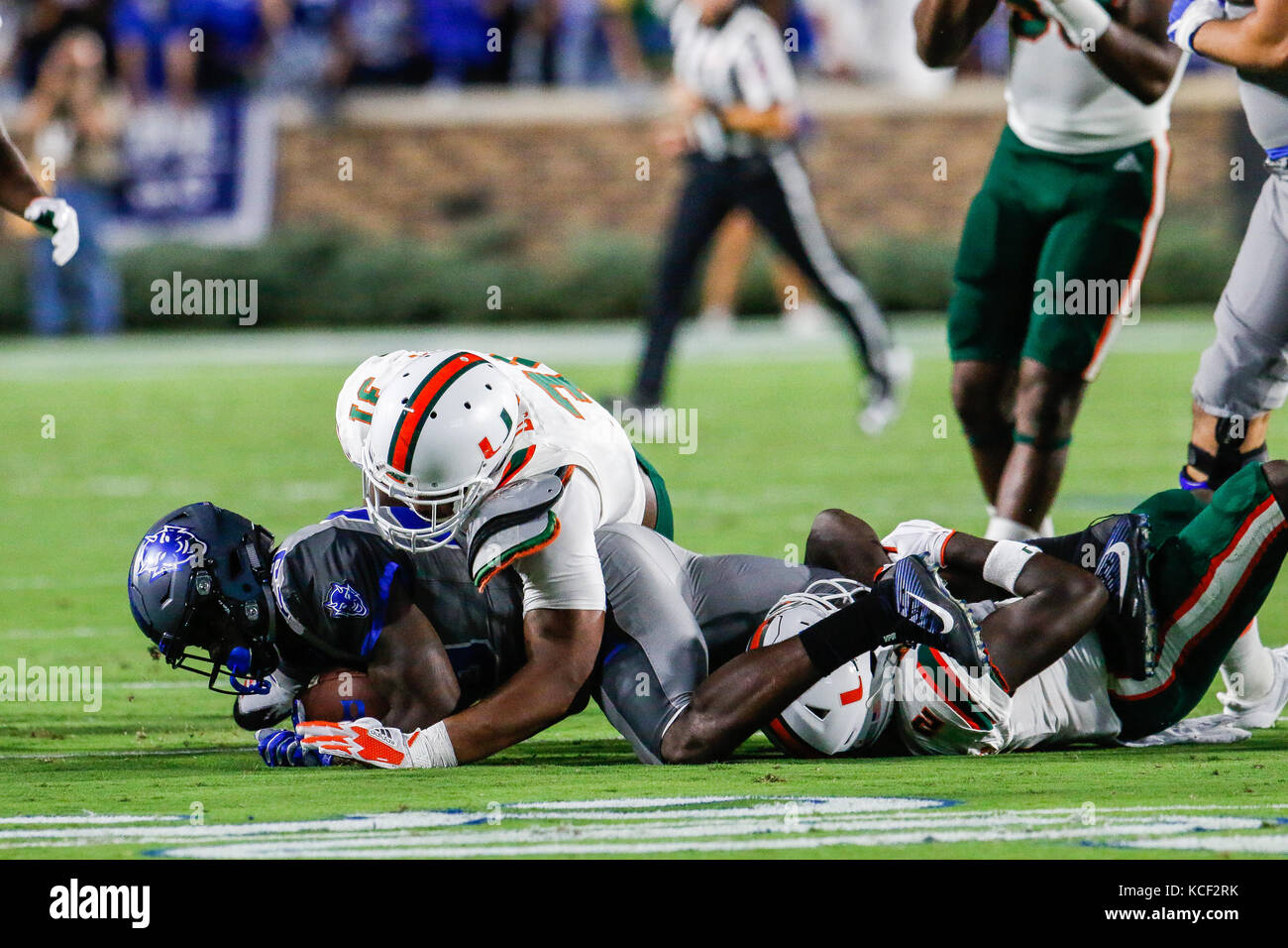 September 29, 2017: Shaun Wilson (29) of the Duke Blue Devils gets taken down by Trajan Bandy (2) of the Miami Hurricanes in the NCAA matchup between Miami and Duke at Wallace Wade Stadium in Durham, NC. (Scott Kinser/Cal Sport Media) Stock Photo