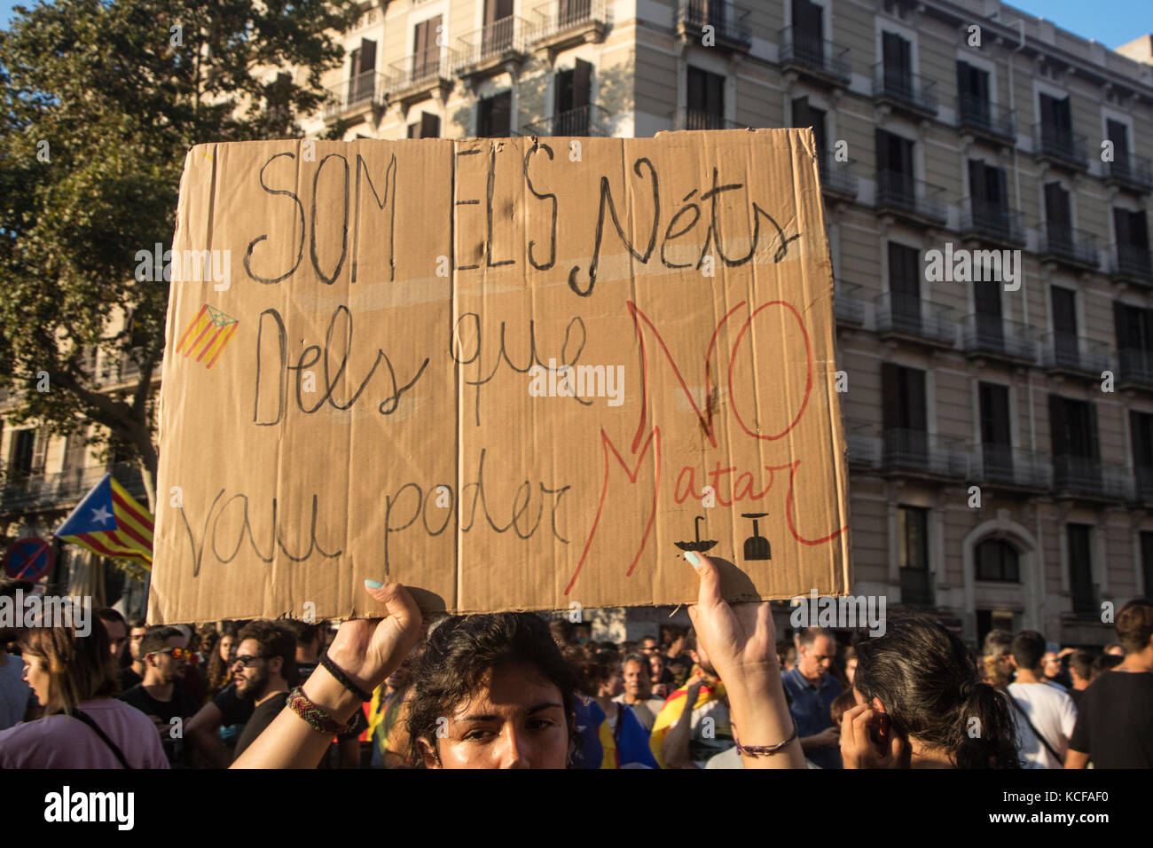 Barcelona, Spain - October 3, 2017. Demonstrators bearing placards during protests for independence in Barcelona, Catalonia, Spain. On that banner is said: 'We are the grandsons of grandparents you could not kill (referring spanish civil war in 1936-39' Stock Photo