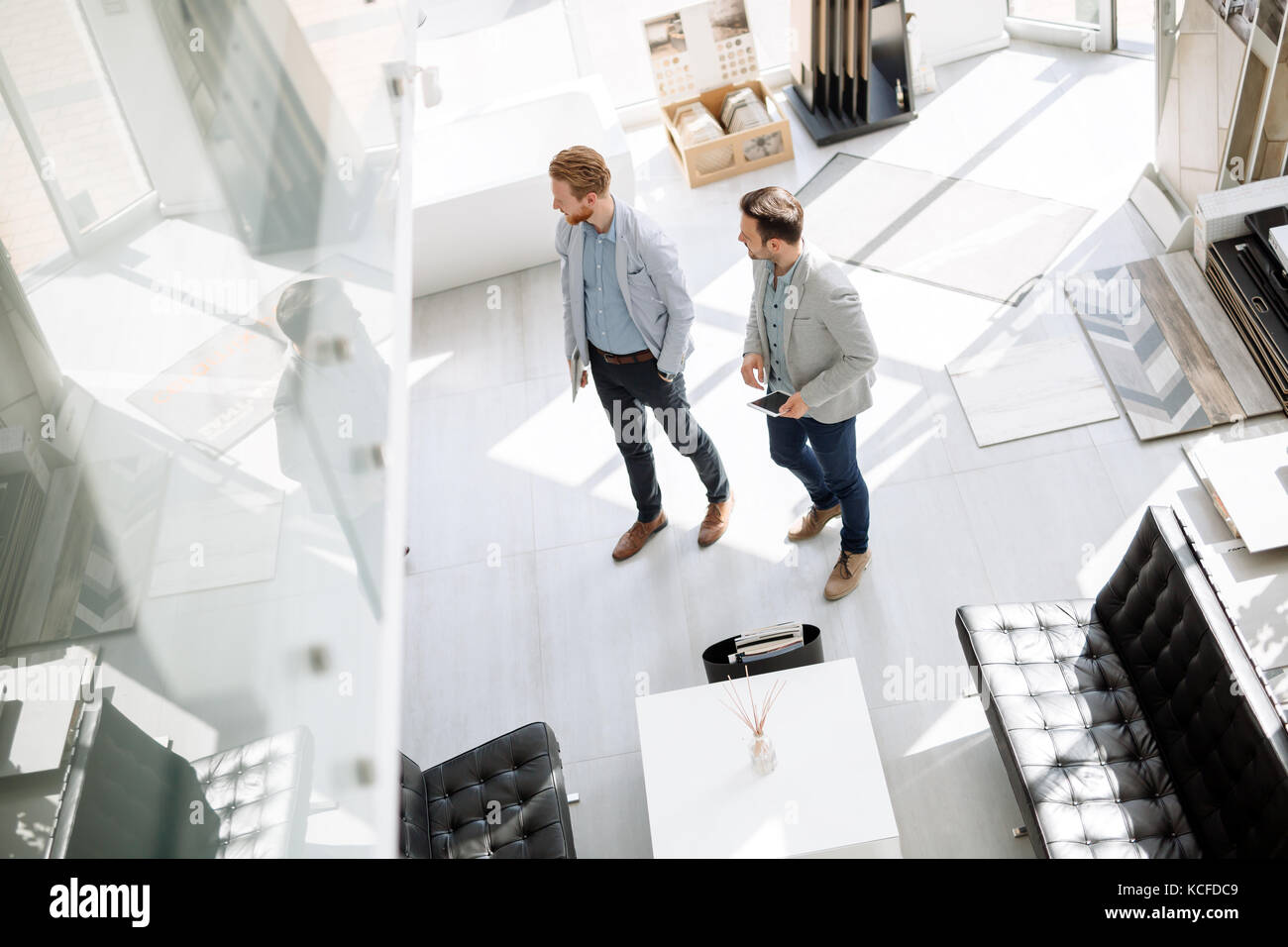 Customers entering interior design store Stock Photo - Alamy