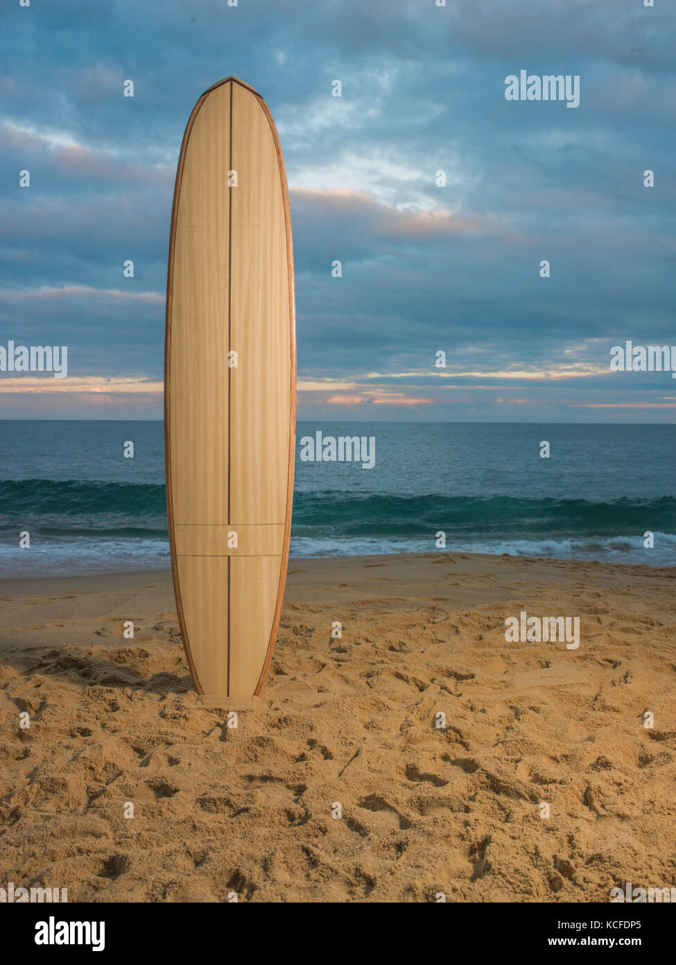 Surfboard stuck in sand at the beach Stock Photo Alamy