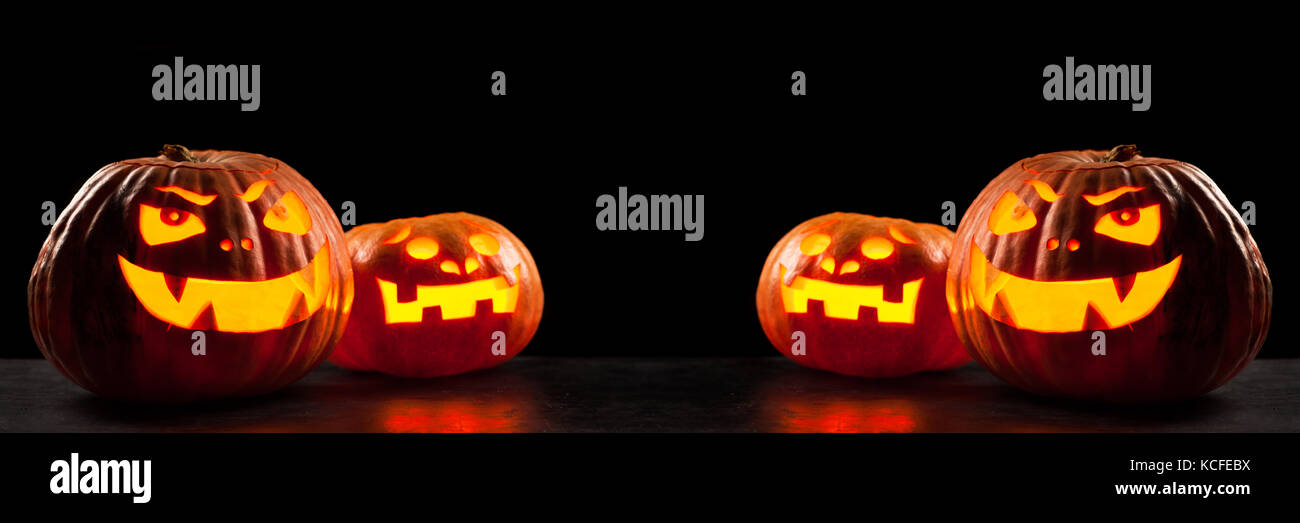 Halloween Jack O' Lantern pumpkins on dark night background Stock Photo ...