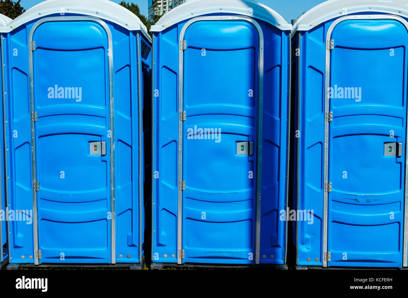 Blue porta potties at event Stock Photo Alamy