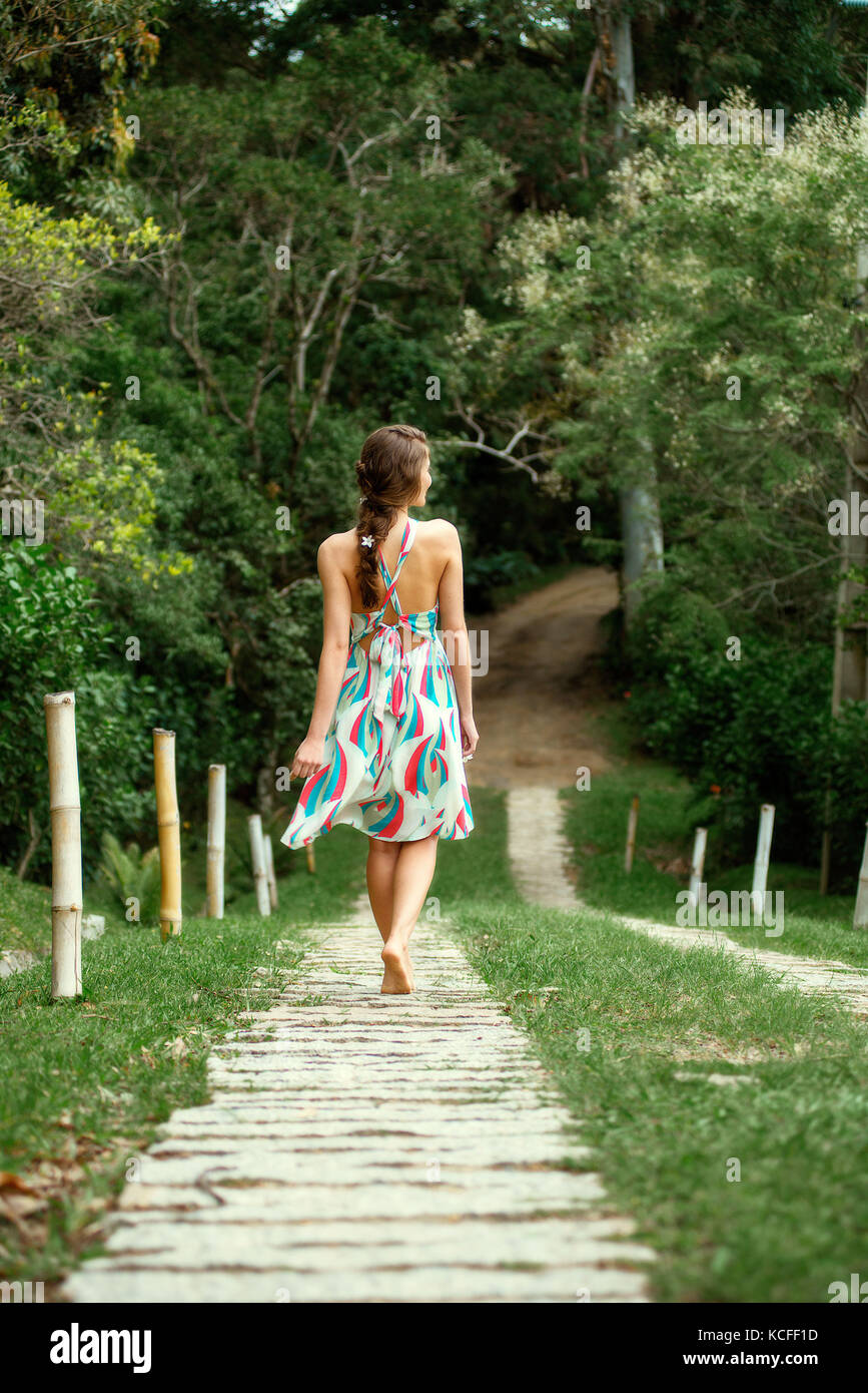 Woman walking barefoot grass legs hi-res stock photography and images ...