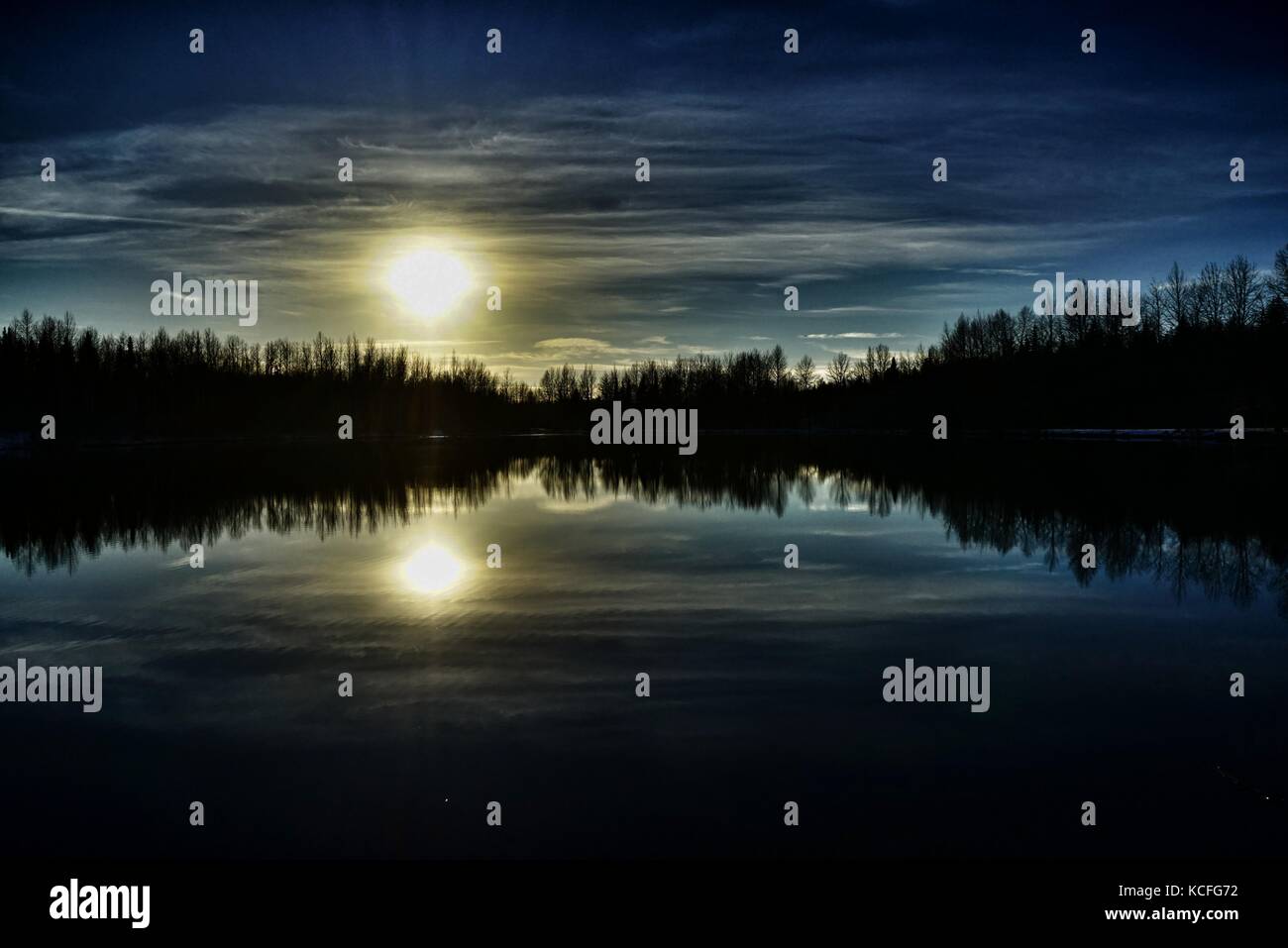 Dark Sunset Reflection Stock Photo