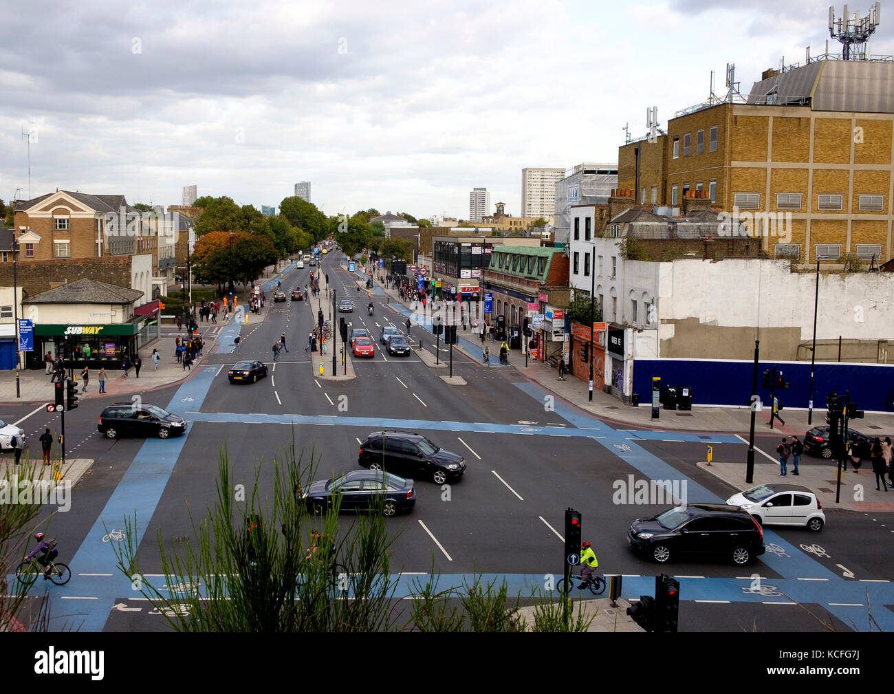 The A11 Mile End Road, at Mile End Tube Station and the junction with Grove Road, London as viewed from the Green Bridge Stock Photo