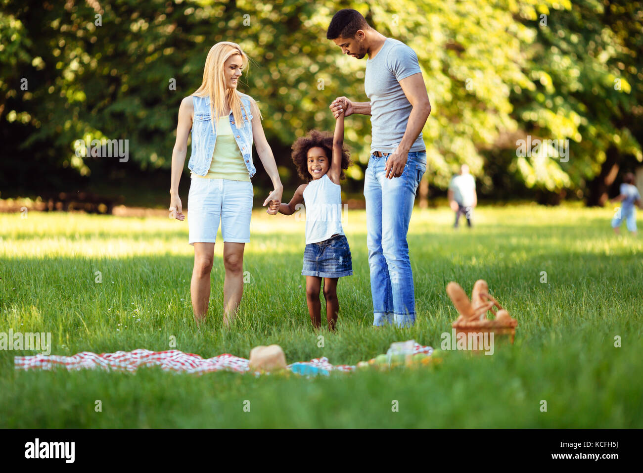 happy-young-couple-spending-time-with-their-daughter-stock-photo-alamy